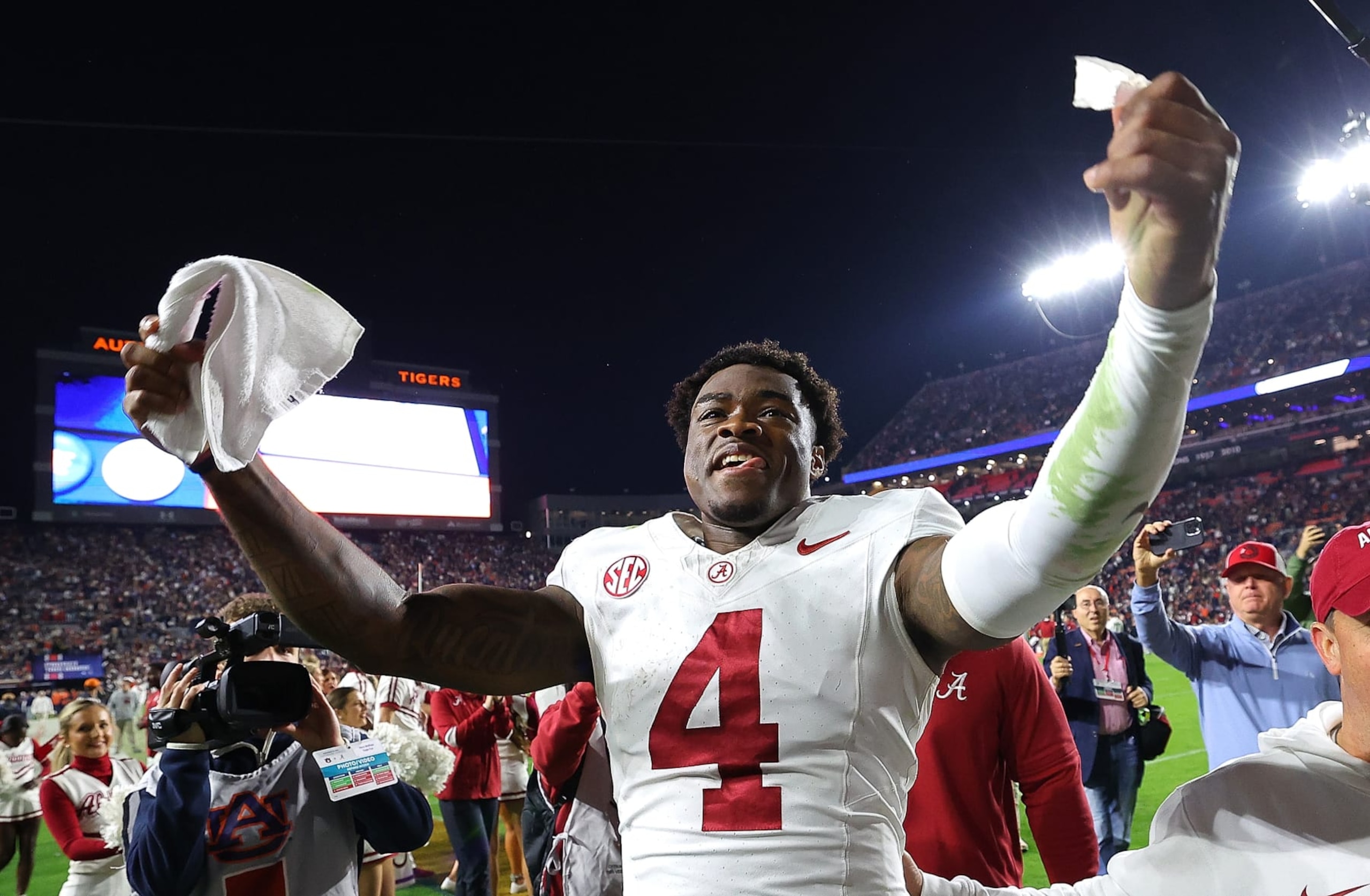AUBURN, ALABAMA - NOVEMBER 25:  Jalen Milroe #4 of the Alabama Crimson Tide celebrates their 27-24 win over the Auburn Tigers at Jordan-Hare Stadium on November 25, 2023 in Auburn, Alabama. (Photo by Kevin C. Cox/Getty Images)