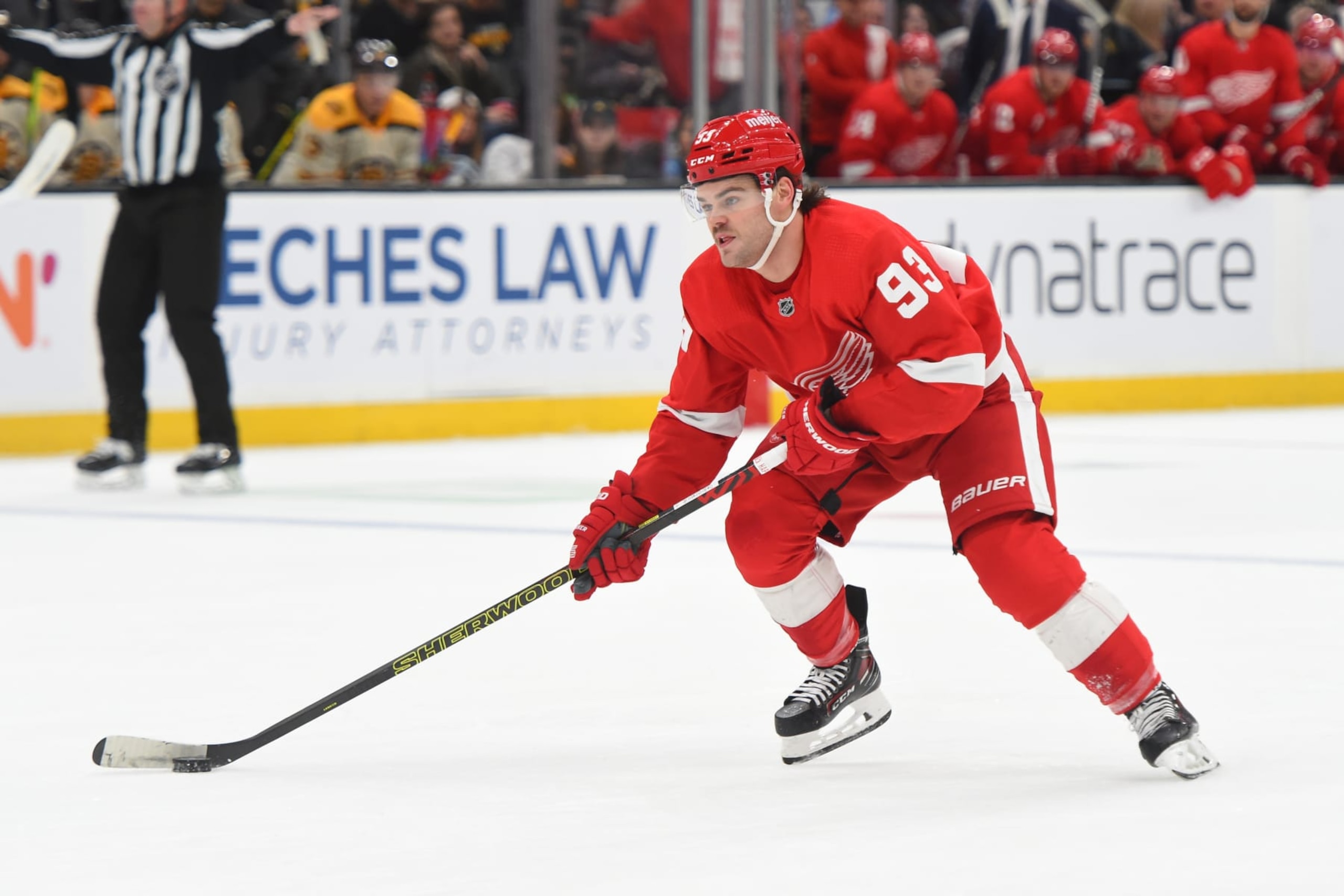BOSTON, MASSACHUSETTS - NOVEMBER 24: Alex DeBrincat #93 of the Detroit Red Wings skates with the puck against the Boston Bruins on November 24, 2023 at the TD Garden in Boston, Massachusetts. (Photo by Steve Babineau/NHLI via Getty Images)