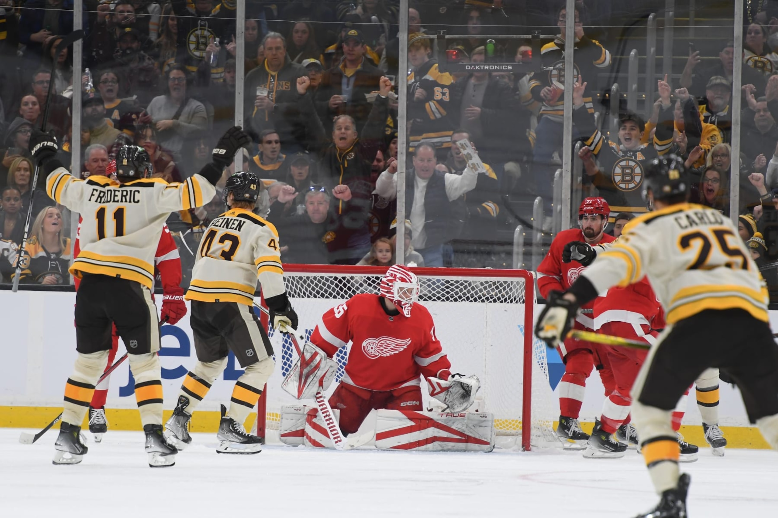 BOSTON, MASSACHUSETTS - NOVEMBER 24: The Boston Bruins celebrate the third-period goal against the Detroit Red Wings on November 24, 2023 at the TD Garden in Boston, Massachusetts. (Photo by Steve Babineau/NHLI via Getty Images)