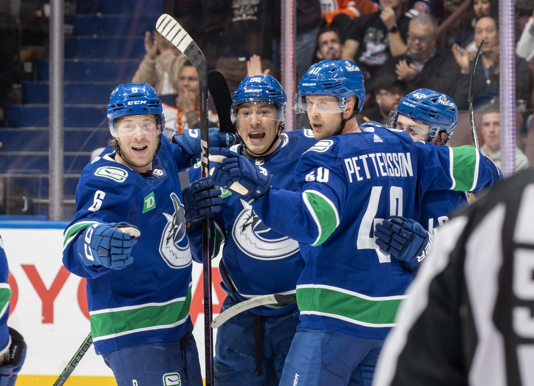 VANCOUVER, CANADA - OCTOBER 11: Elias Pettersson #40 of the Vancouver Canucks celebrates his goal with teammates during the second period of their NHL game against the the Edmonton Oilers at Rogers Arena October 11, 2023 in Vancouver, British Columbia, Canada.  (Photo by Jeff Vinnick/NHLI via Getty Images)