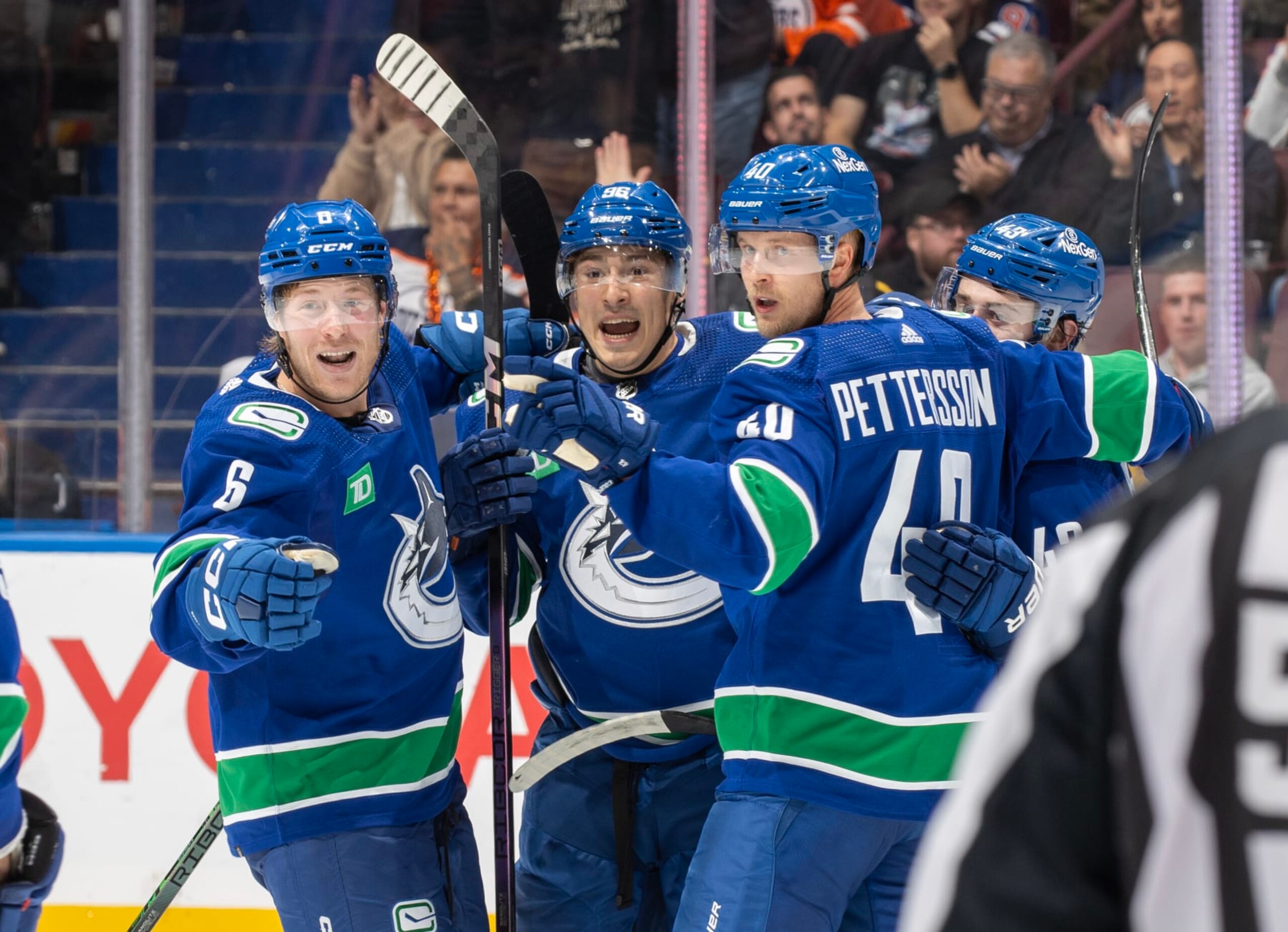 VANCOUVER, CANADA - OCTOBER 11: Elias Pettersson #40 of the Vancouver Canucks celebrates his goal with teammates during the second period of their NHL game against the the Edmonton Oilers at Rogers Arena October 11, 2023 in Vancouver, British Columbia, Canada.  (Photo by Jeff Vinnick/NHLI via Getty Images)