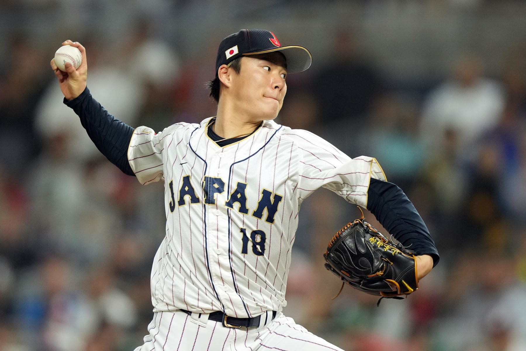 MIAMI, FLORIDA - MARCH 20: Yoshinobu Yamamoto #18 of Team Japan pitches in the eighth inning against Team Mexico during the World Baseball Classic Semifinals at loanDepot park on March 20, 2023 in Miami, Florida. (Photo by Eric Espada/Getty Images)