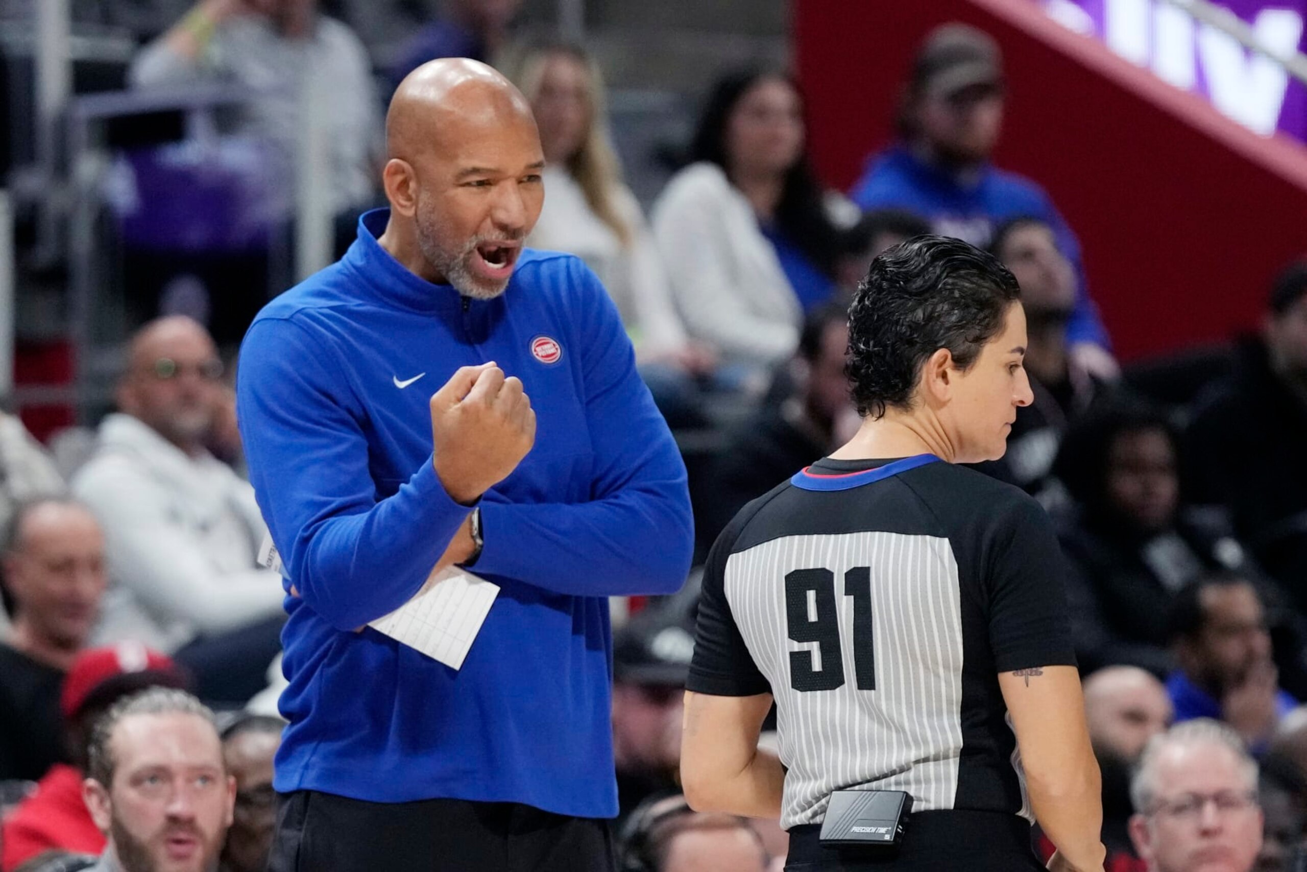Detroit Pistons head coach Monty Williams talks with referee Che Flores during the first half of an NBA basketball game against the Washington Wizards, Monday, Nov. 27, 2023, in Detroit. (AP Photo/Carlos Osorio)