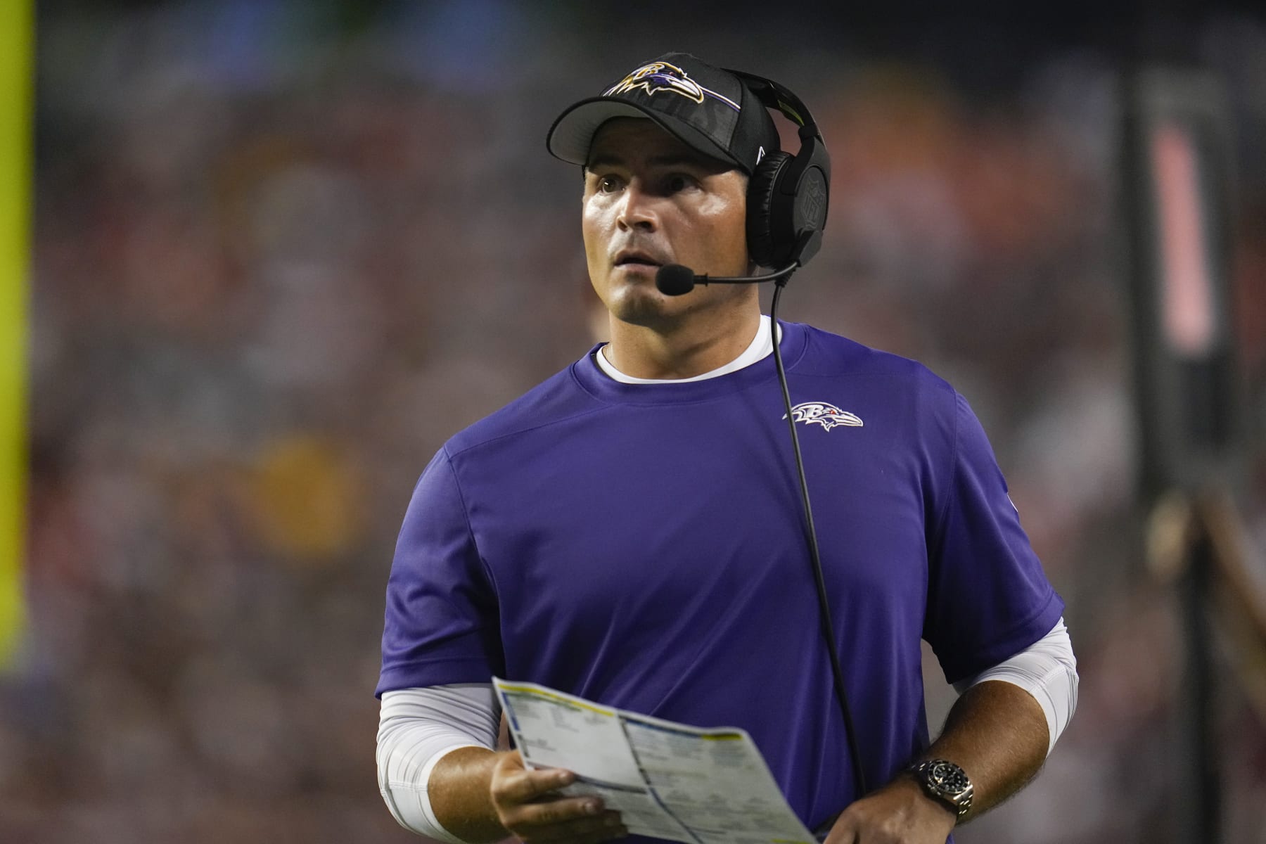 Baltimore Ravens defensive coordinator Mike Macdonald looks on during the first half of an NFL preseason football game between the Washington Commanders and the Baltimore Ravens, Monday, Aug. 21, 2023, in Landover, Md. The Commanders won 29-28. (AP Photo/Julio Cortez)