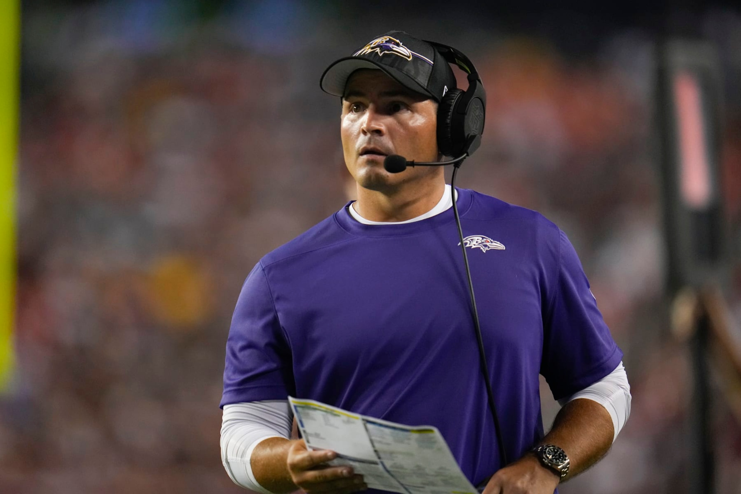 Baltimore Ravens defensive coordinator Mike Macdonald looks on during the first half of an NFL preseason football game between the Washington Commanders and the Baltimore Ravens, Monday, Aug. 21, 2023, in Landover, Md. The Commanders won 29-28. (AP Photo/Julio Cortez)
