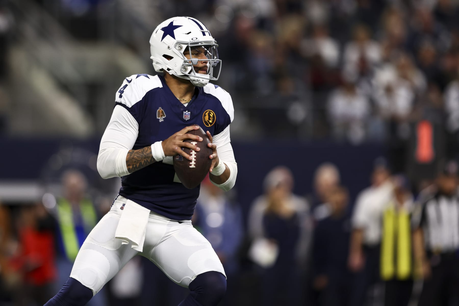 ARLINGTON, TX - NOVEMBER 23: Dak Prescott #4 of the Dallas Cowboys drops back to pass during an NFL football game against the Washington Commanders at AT&T Stadium on November 23, 2023 in Arlington, Texas. (Photo by Kevin Sabitus/Getty Images)
