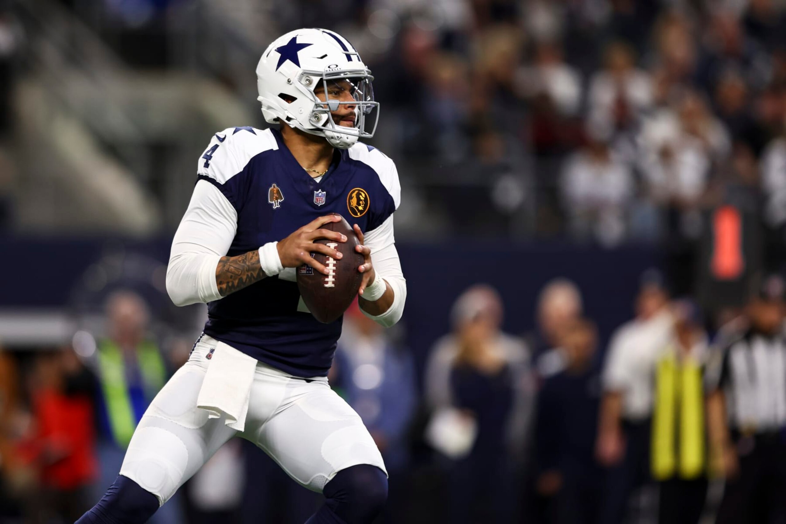 ARLINGTON, TX - NOVEMBER 23: Dak Prescott #4 of the Dallas Cowboys drops back to pass during an NFL football game against the Washington Commanders at AT&T Stadium on November 23, 2023 in Arlington, Texas. (Photo by Kevin Sabitus/Getty Images)