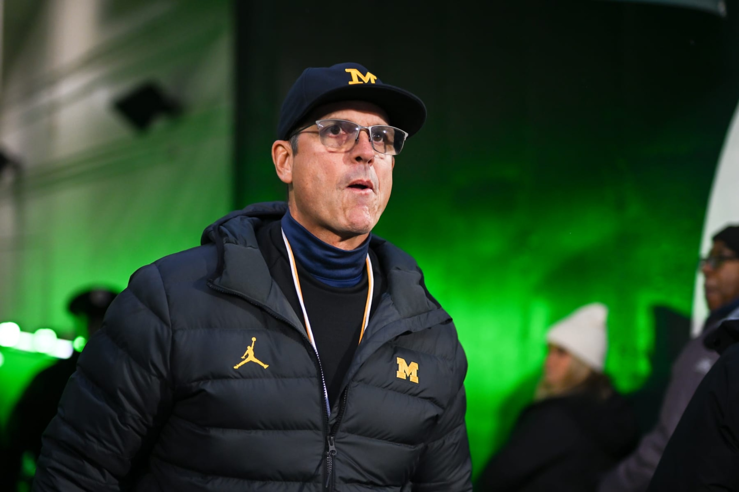EAST LANSING, MI - OCTOBER 21: Michigan Wolverines head coach Jim Harbaugh walks through the tunnel prior to  a college football game between the Michigan State Spartans and Michigan Wolverines on October 21, 2023 at Spartan Stadium in East Lansing, MI. (Photo by Adam Ruff/Icon Sportswire via Getty Images)
