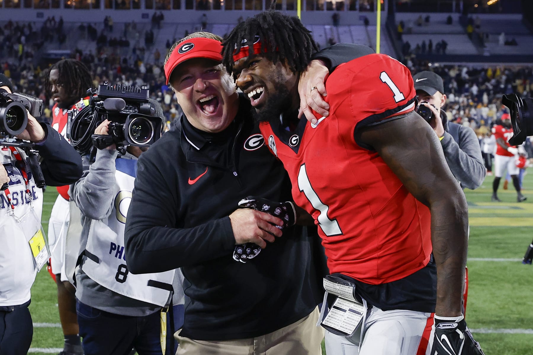 ATLANTA, GEORGIA - NOVEMBER 25: Head coach Kirby Smart of the Georgia Bulldogs reacts with Marcus Rosemy-Jacksaint #1 following the 31-23 victory over the Georgia Tech Yellow Jackets at Bobby Dodd Stadium on November 25, 2023 in Atlanta, Georgia. (Photo by Todd Kirkland/Getty Images)