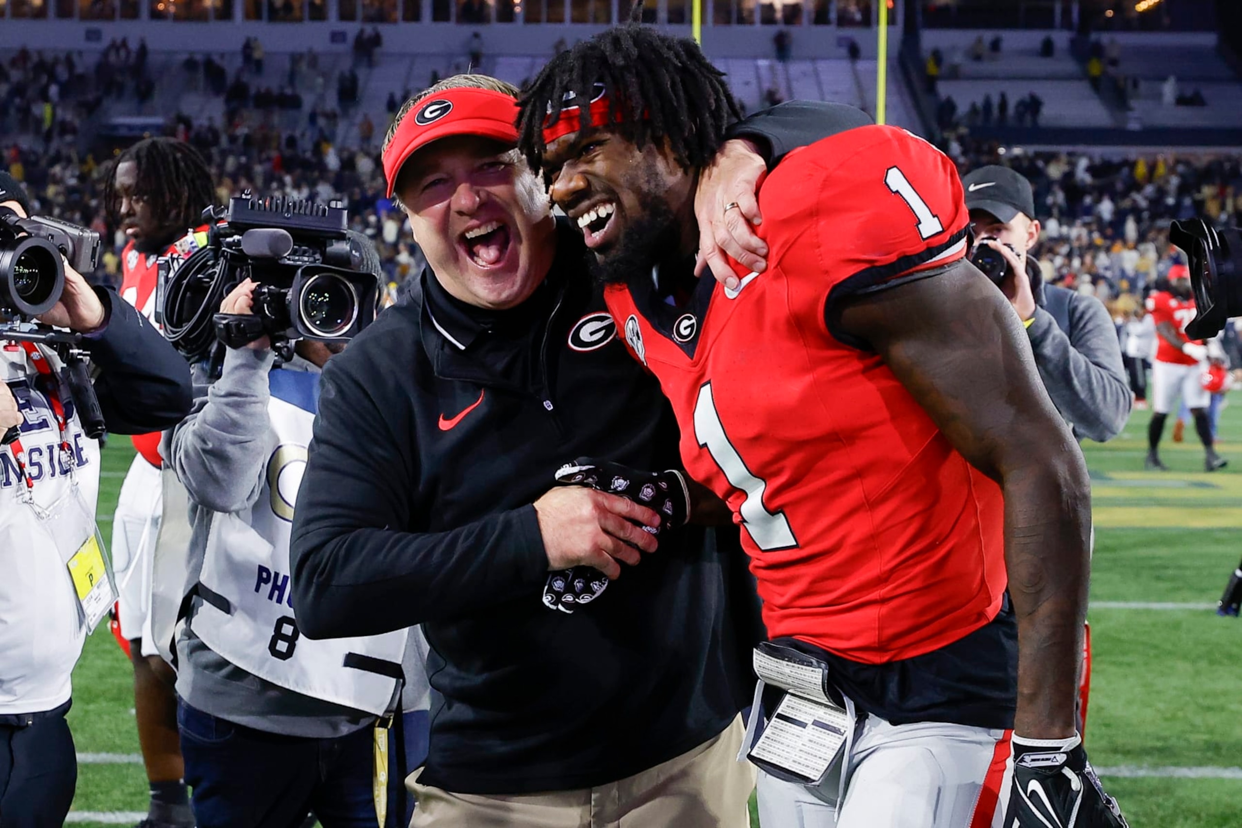 ATLANTA, GEORGIA - NOVEMBER 25: Head coach Kirby Smart of the Georgia Bulldogs reacts with Marcus Rosemy-Jacksaint #1 following the 31-23 victory over the Georgia Tech Yellow Jackets at Bobby Dodd Stadium on November 25, 2023 in Atlanta, Georgia. (Photo by Todd Kirkland/Getty Images)