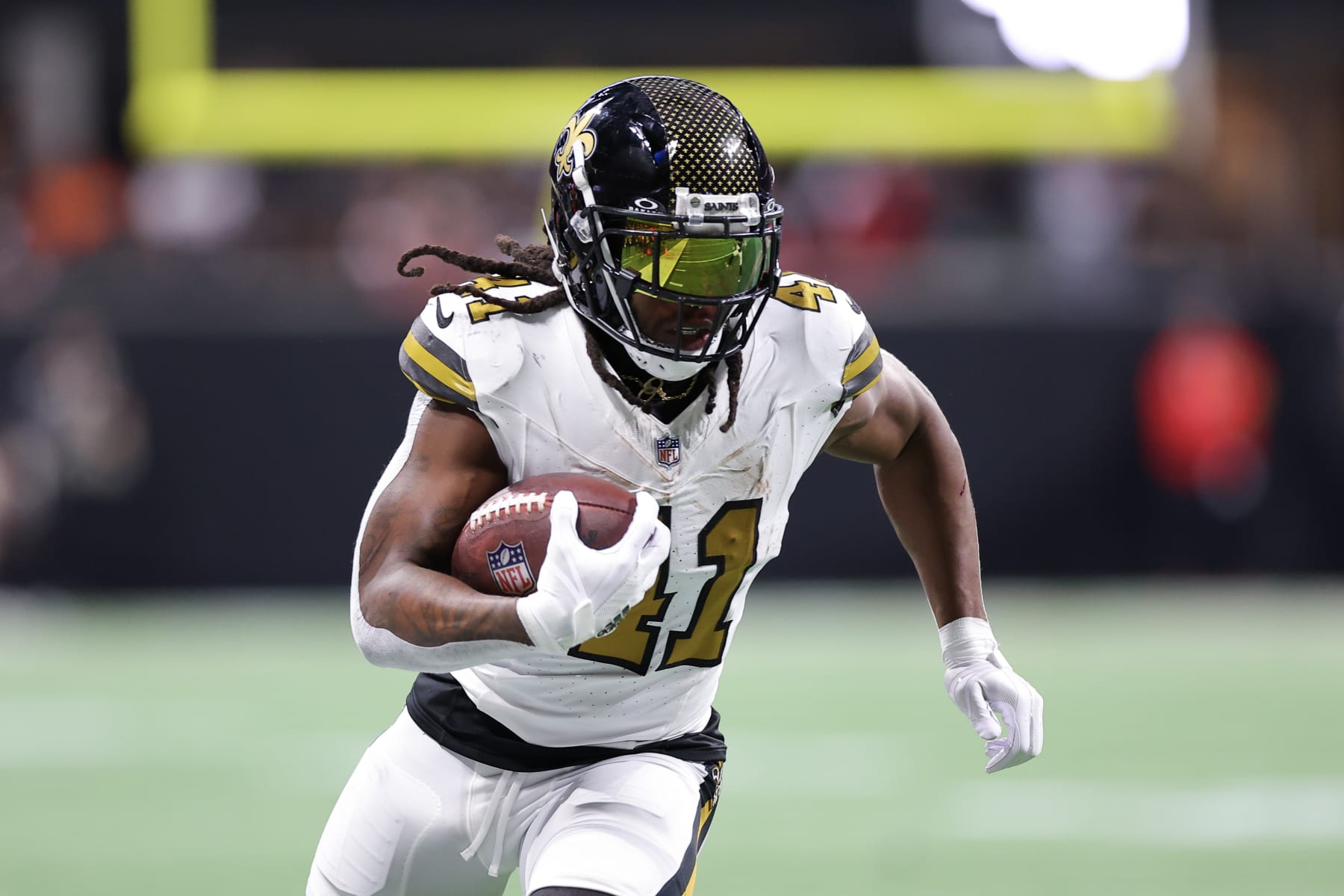 ATLANTA, GEORGIA - NOVEMBER 26: Alvin Kamara #41 of the New Orleans Saints runs with the ball after a reception in the first quarter of the game against the Atlanta Falcons at Mercedes-Benz Stadium on November 26, 2023 in Atlanta, Georgia. (Photo by Kevin C. Cox/Getty Images)