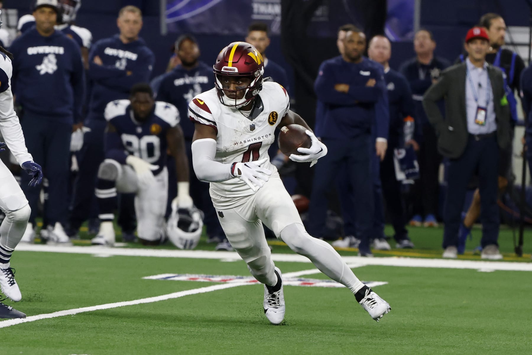 Washington Commanders wide receiver Curtis Samuel (4) runs after a reception during an NFL Football game in Arlington, Texas, Sunday, Nov. 23, 2023. (AP Photo/Michael Ainsworth)