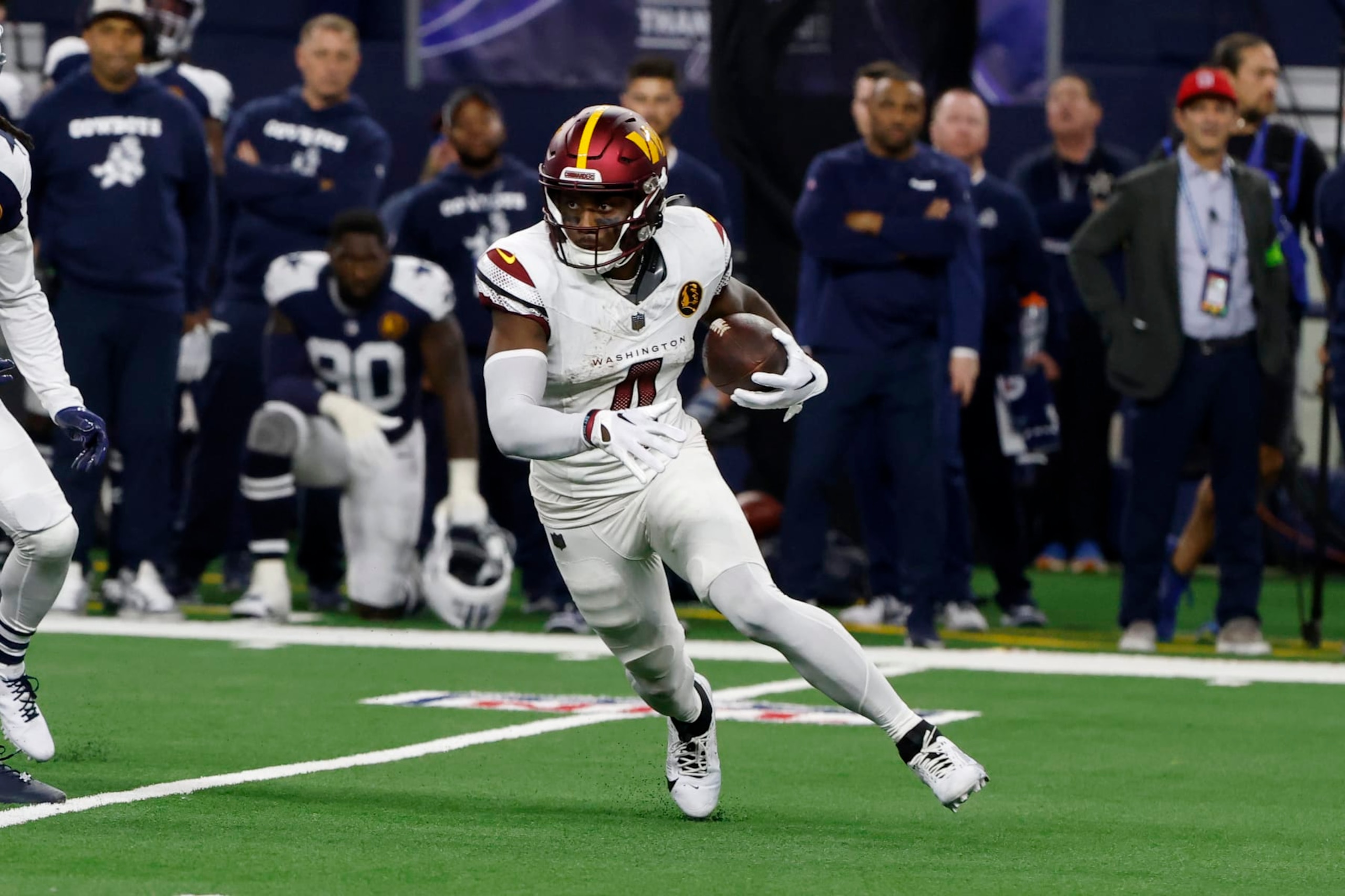 Washington Commanders wide receiver Curtis Samuel (4) runs after a reception during an NFL Football game in Arlington, Texas, Sunday, Nov. 23, 2023. (AP Photo/Michael Ainsworth)