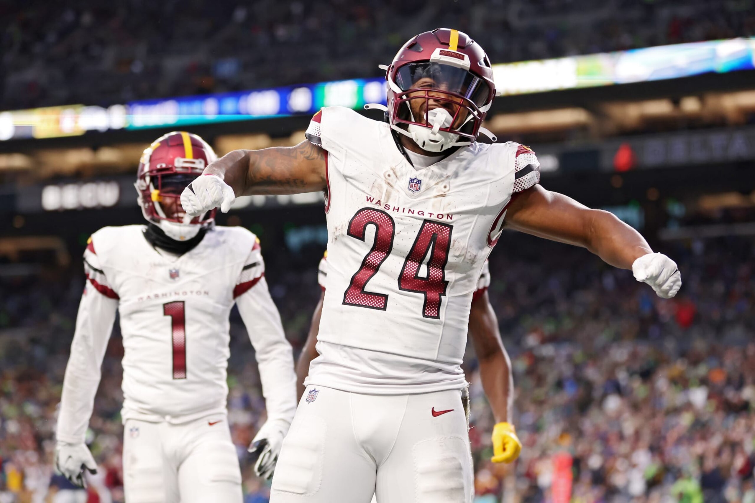 SEATTLE, WASHINGTON - NOVEMBER 12: Antonio Gibson #24 of the Washington Commanders celebrates after scoring a receiving touchdown during the fourth quarter against the Seattle Seahawks at Lumen Field on November 12, 2023 in Seattle, Washington. (Photo by Steph Chambers/Getty Images)