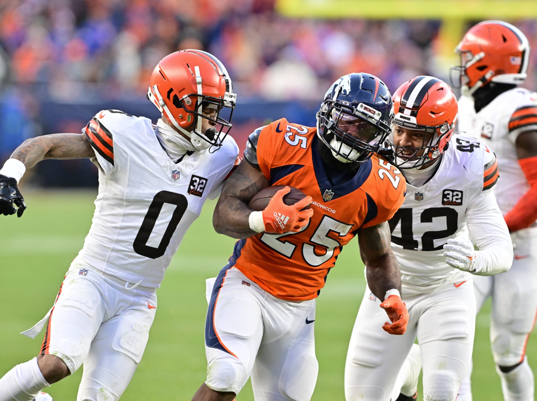 DENVER, CO - NOVEMBER 26: Denver Broncos running back Samaje Perine (25) on a long run against =c0 and Cleveland Browns linebacker Tony Fields II (42) in the third quarter at Empower Field at Mile High November 26, 2023. (Photo by Andy Cross/MediaNews Group/The Denver Post via Getty Images)