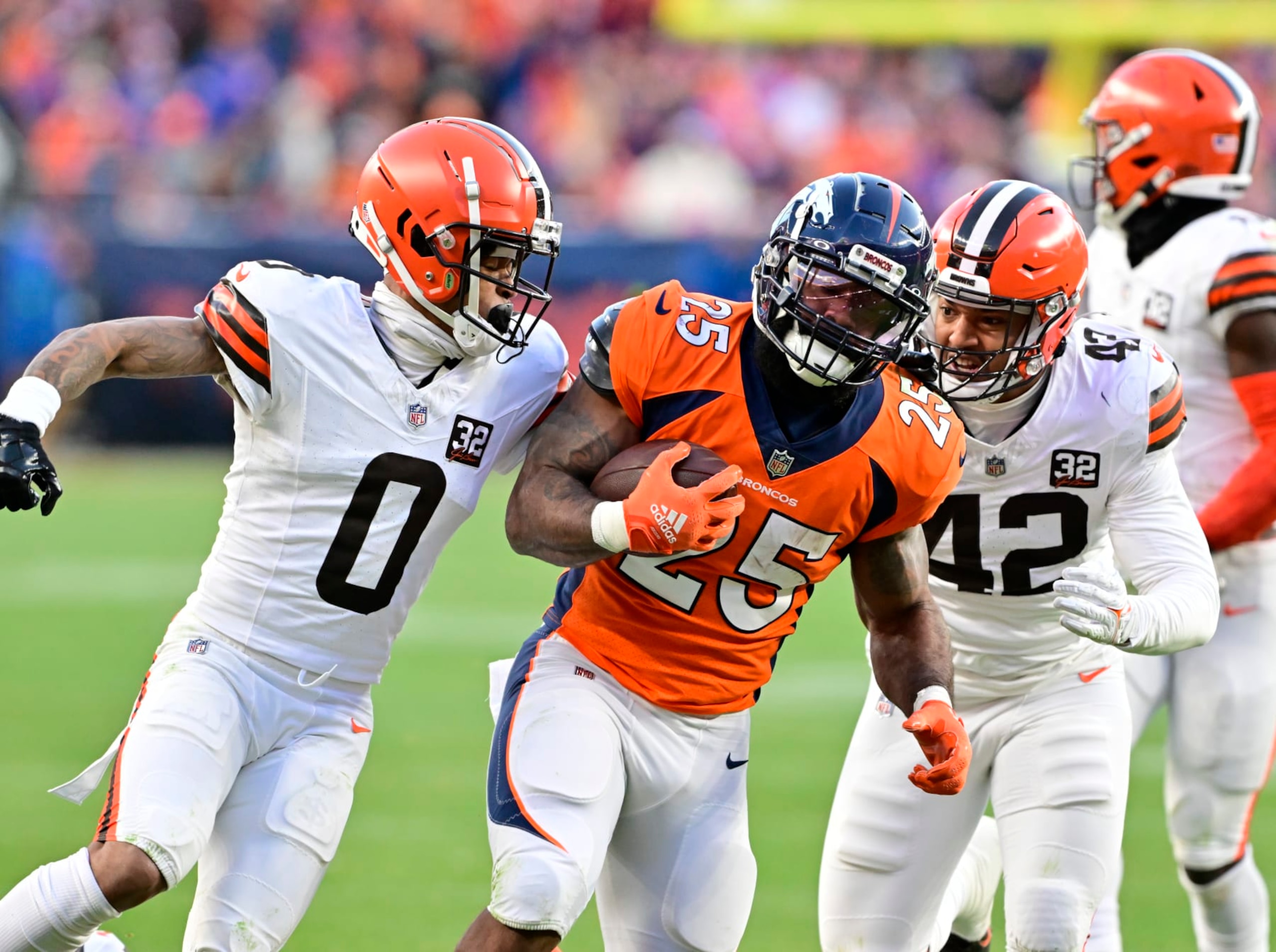 DENVER, CO - NOVEMBER 26: Denver Broncos running back Samaje Perine (25) on a long run against =c0 and Cleveland Browns linebacker Tony Fields II (42) in the third quarter at Empower Field at Mile High November 26, 2023. (Photo by Andy Cross/MediaNews Group/The Denver Post via Getty Images)