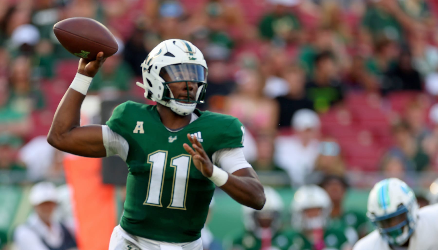 TAMPA, FLORIDA - OCTOBER 15: Gerry Bohanon  #11 of the South Florida Bulls passes during a game against the Tulane Green Wave at Raymond James Stadium on October 15, 2022 in Tampa, Florida. (Photo by Mike Ehrmann/Getty Images)