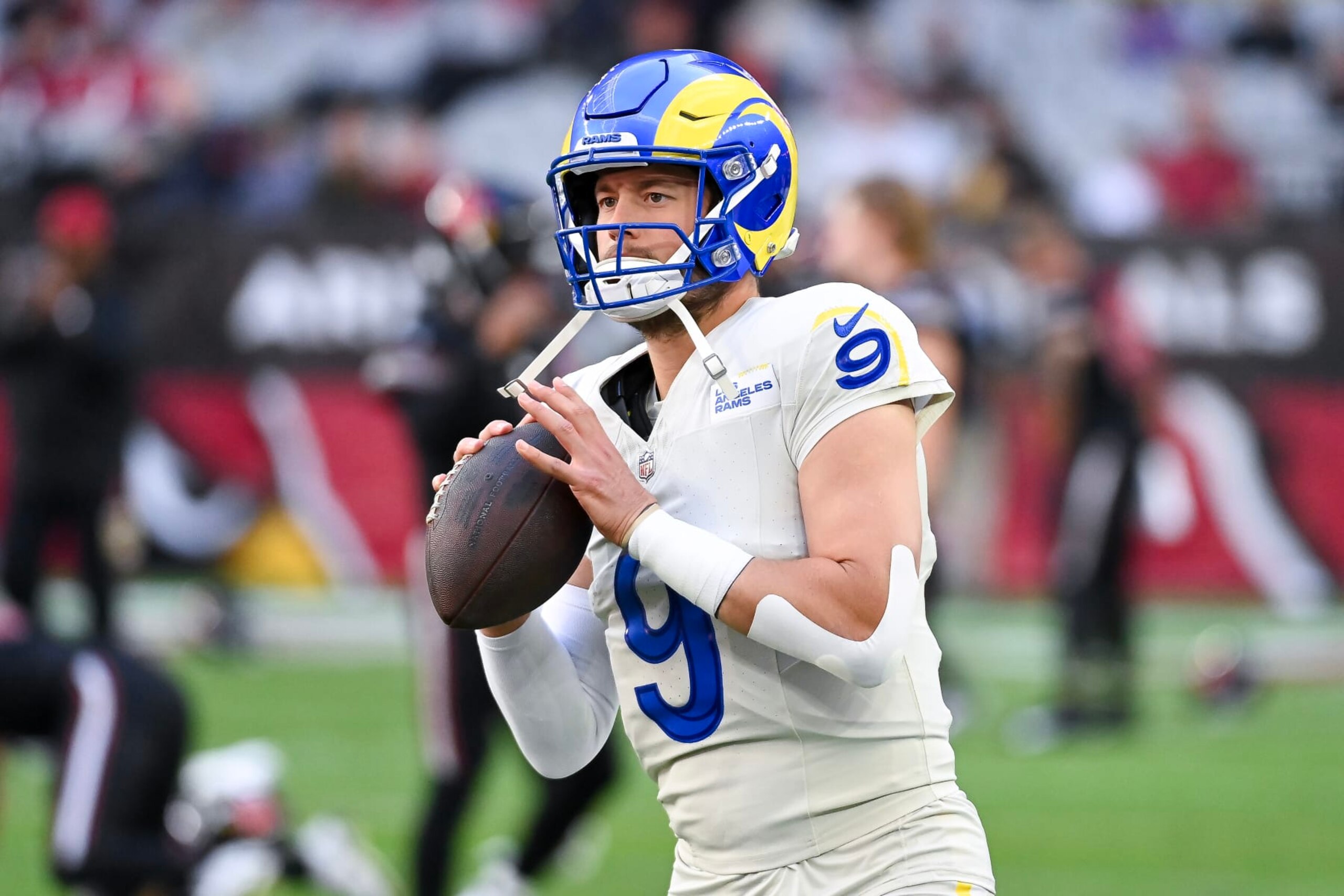 GLENDALE, ARIZONA - NOVEMBER 26: Matthew Stafford #9 of the Los Angeles Rams warms up prior to a game against the Arizona Cardinals at State Farm Stadium on November 26, 2023 in Glendale, Arizona. (Photo by Norm Hall/Getty Images)