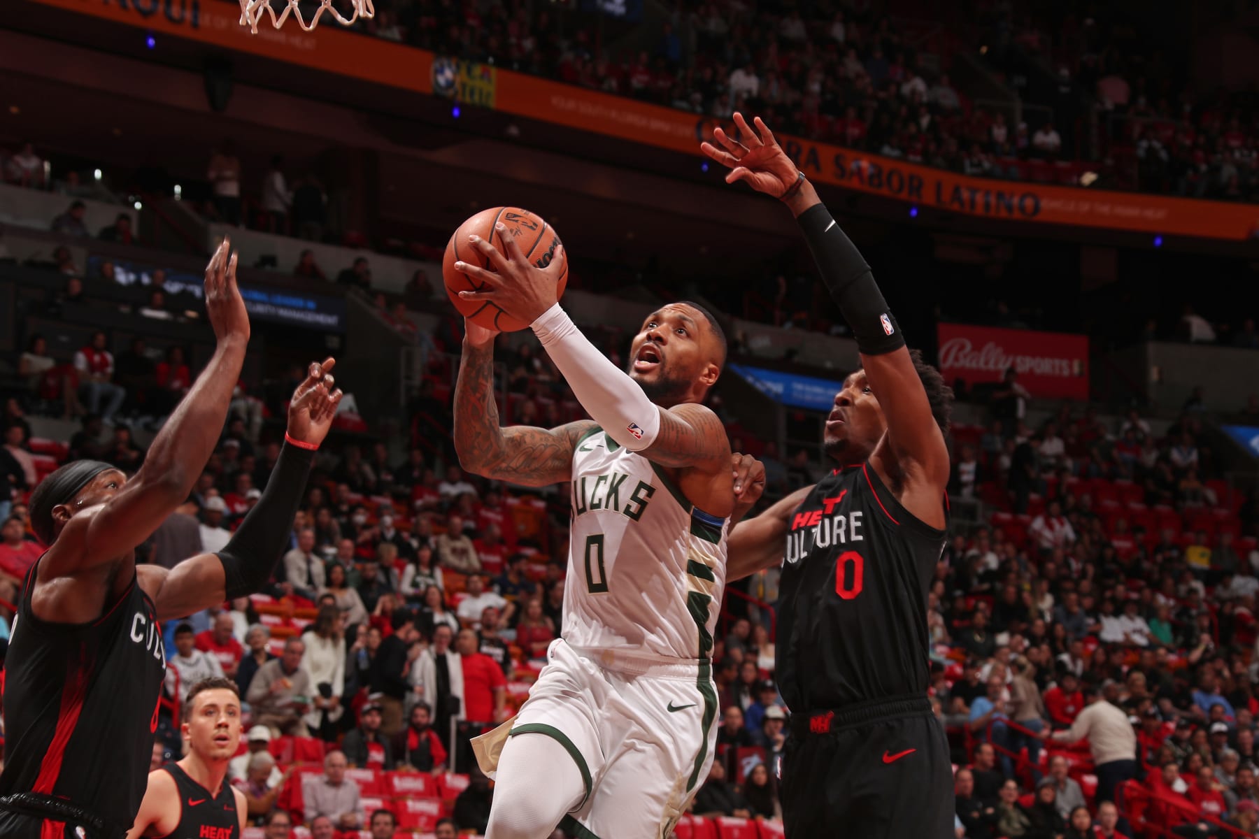 MIAMI, FL - NOVEMBER 28: Damian Lillard #0 of the Milwaukee Bucks drives to the basket during the game against the Miami Heat during the In-Season Tournament on November 28, 2023 at Kaseya Center in Miami, Florida. NOTE TO USER: User expressly acknowledges and agrees that, by downloading and or using this Photograph, user is consenting to the terms and conditions of the Getty Images License Agreement. Mandatory Copyright Notice: Copyright 2023 NBAE (Photo by Issac Baldizon/NBAE via Getty Images) MIAMI, FL - NOVEMBER 28: Damian Lillard #0 of the Milwaukee Bucks drives to the basket during the game against the Miami Heat during the In-Season Tournament on November 28, 2023 at Kaseya Center in Miami, Florida. NOTE TO USER: User expressly acknowledges and agrees that, by downloading and or using this Photograph, user is consenting to the terms and conditions of the Getty Images License Agreement. Mandatory Copyright Notice: Copyright 2023 NBAE (Photo by Issac Baldizon/NBAE via Getty Images)