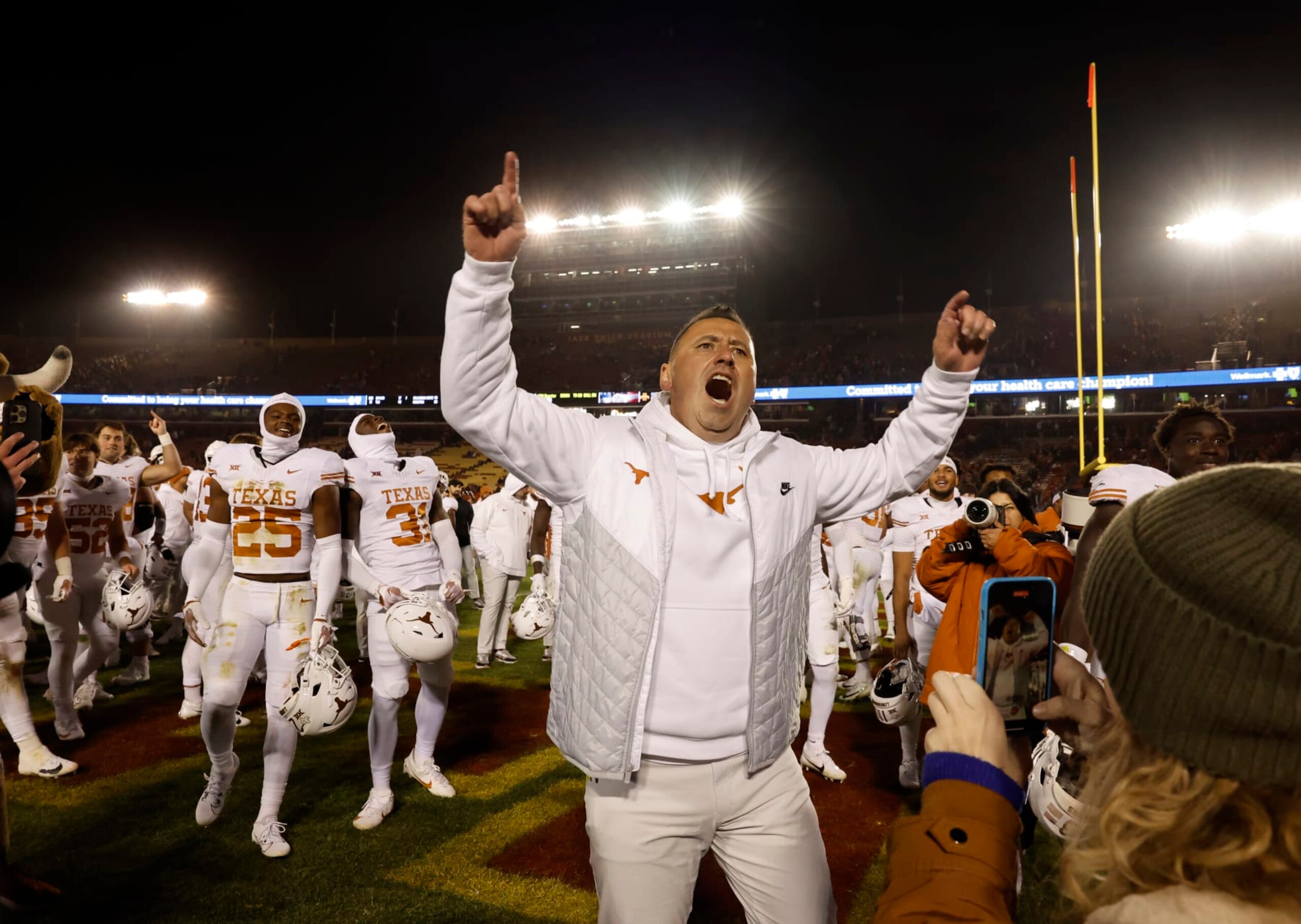 AMES, IA - NOVEMBER 18: Steve Sarkisian head coach of the Texas Longhorns celebrates with his team and Texas Longhorns fans after winning 26-16 over the Iowa State Cyclones at Jack Trice Stadium on November 18, 2023 in Ames, Iowa. The Texas Longhorns won 26-16 over the Iowa State Cyclones. (Photo by David Purdy/Getty Images)