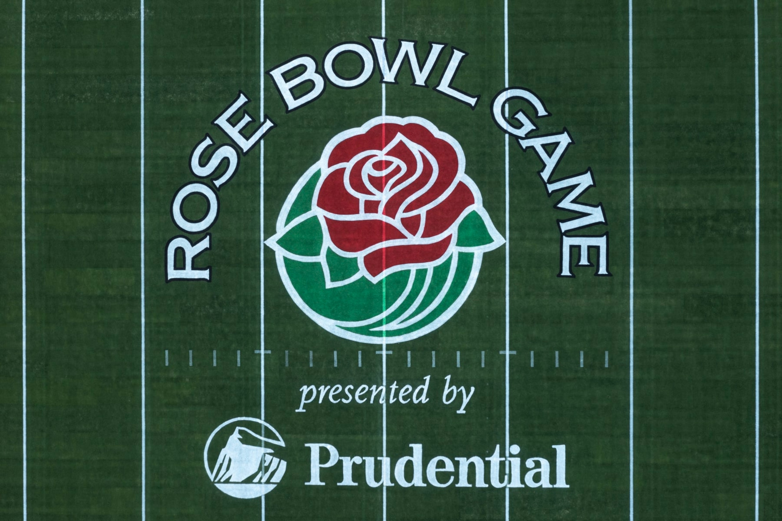 PASADENA, CA - DECEMBER 26: An aerial view of the Rose Bowl Game logo on the field of the 100-year-old Rose Bowl Stadium prior to the Rose Bowl Game on December 26, 2022 in Pasadena, California. The annual American college football bowl game pit the Penn State Nittany Lions and the Utah Utes to battle for the Leishman Trophy on the day of the Tournament of Roses Parade, also known as the Rose Parade. The events are traditionally held on New Year's Day except when it falls on a Sunday, as it will this year, a long-standing rule to prevent frightening horses outside of churches along the parade route and disrupting services. This year, the Tournament of Roses events will occur on Monday, January 2. The Rose Bowl Stadium opened in October 1922.  (Photo by David McNew/Getty Images)