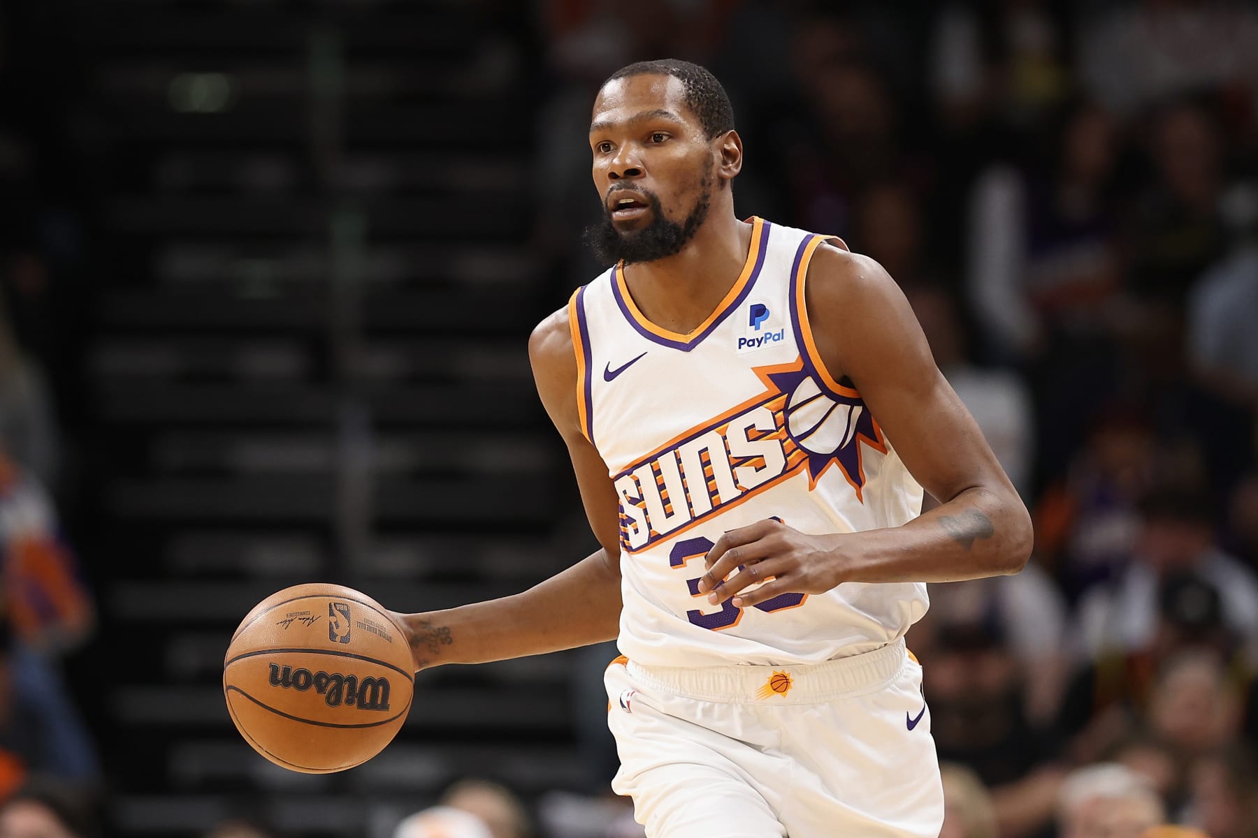 PHOENIX, ARIZONA - NOVEMBER 22: Kevin Durant #35 of the Phoenix Suns handles the ball during the first half of the NBA game at Footprint Center on November 22, 2023 in Phoenix, Arizona. NOTE TO USER: User expressly acknowledges and agrees that, by downloading and or using this photograph, User is consenting to the terms and conditions of the Getty Images License Agreement.  (Photo by Christian Petersen/Getty Images)