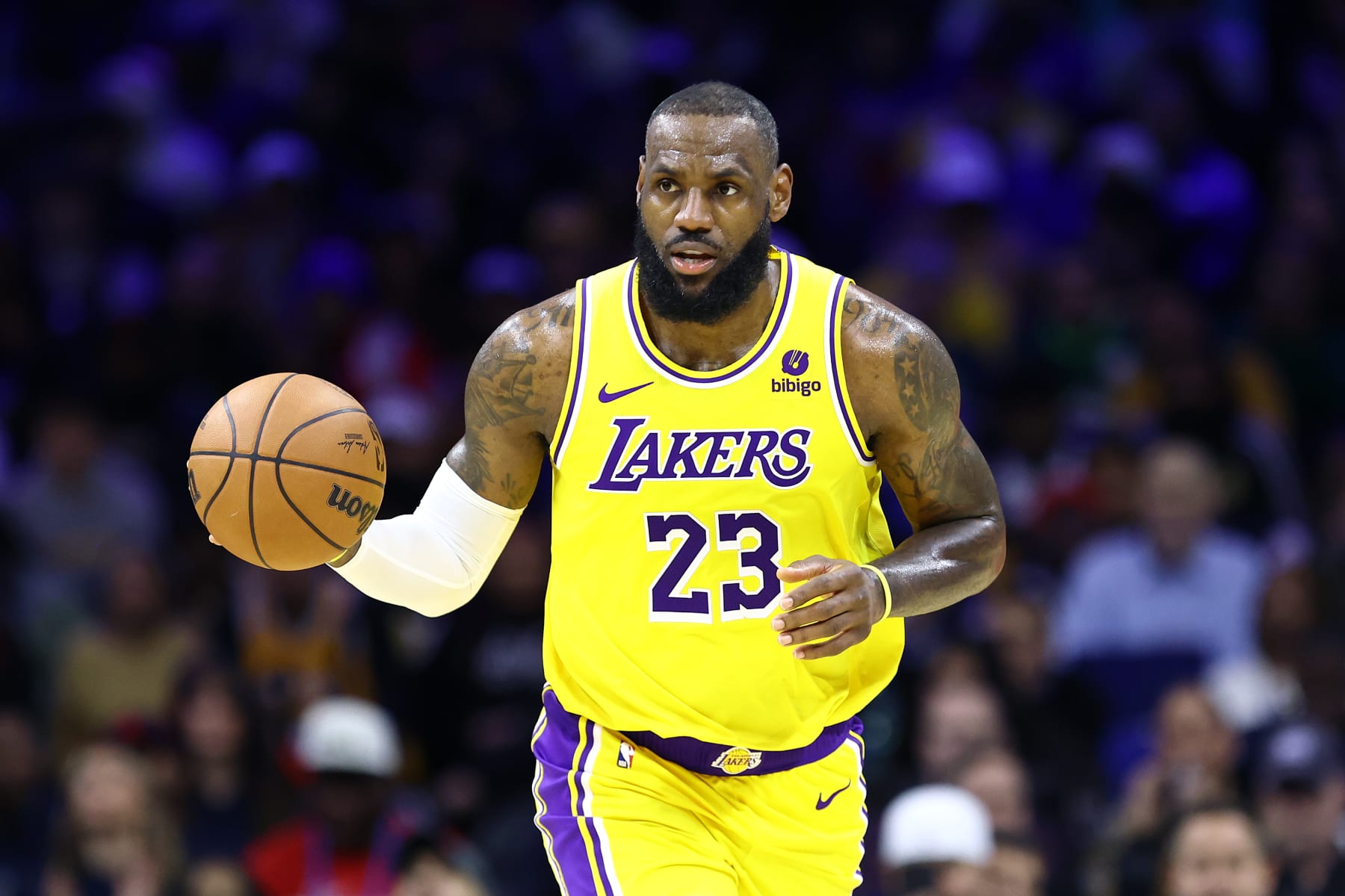 PHILADELPHIA, PENNSYLVANIA - NOVEMBER 27: LeBron James #23 of the Los Angeles Lakers dribbles during the third quarter against the Philadelphia 76ers at the Wells Fargo Center on November 27, 2023 in Philadelphia, Pennsylvania. NOTE TO USER: User expressly acknowledges and agrees that, by downloading and or using this photograph, User is consenting to the terms and conditions of the Getty Images License Agreement. (Photo by Tim Nwachukwu/Getty Images)