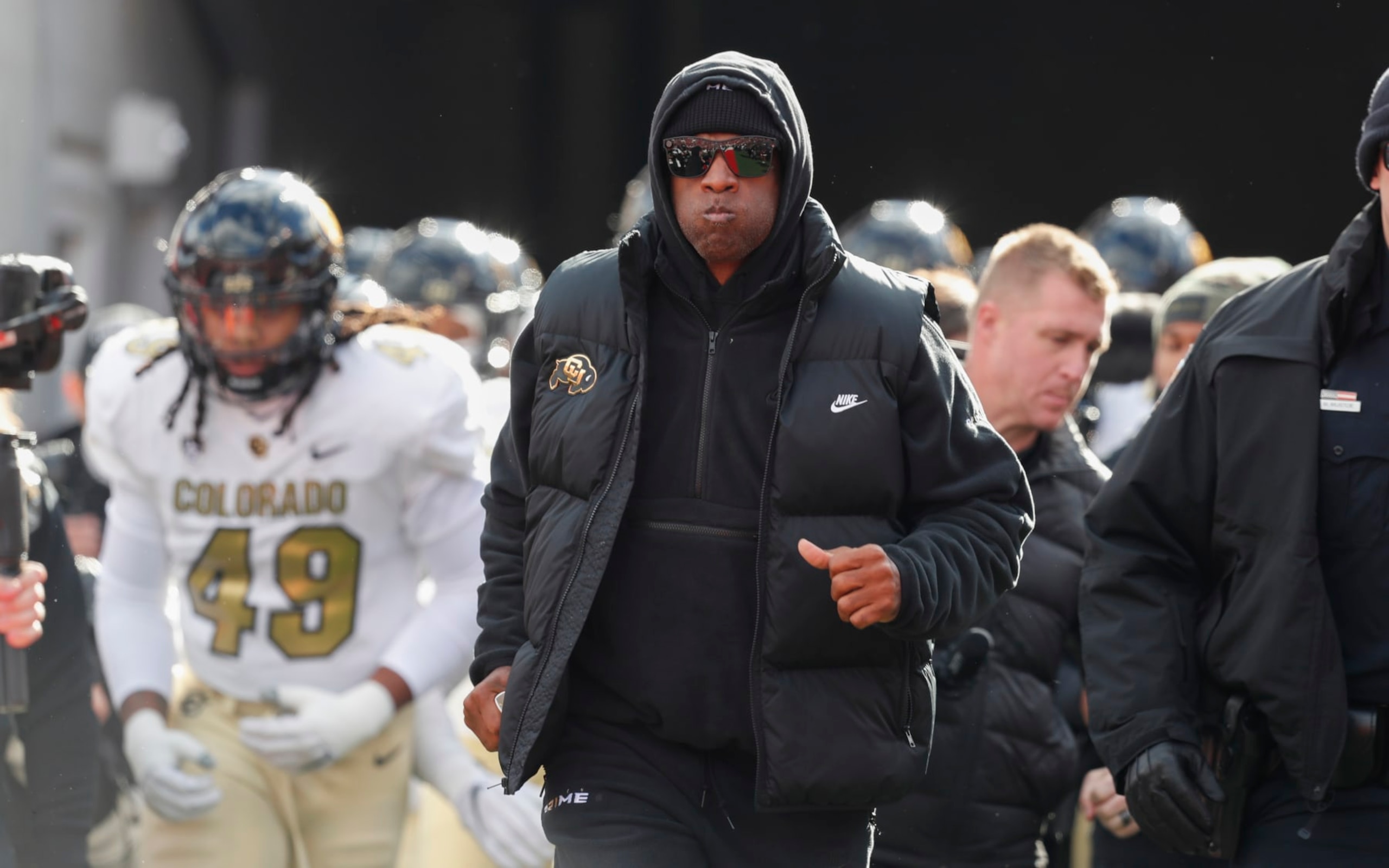 SALT LAKE CITY, UT - NOVEMBER 25: Deion Sanders head coach of the Colorado Buffaloes leads his team onto the field before the start of their game agaisnt the Utah Utes at Rice Eccles Stadium on November 25, 2023 in Salt Lake City, Utah.  (Photo by Chris Gardner/Getty Images)