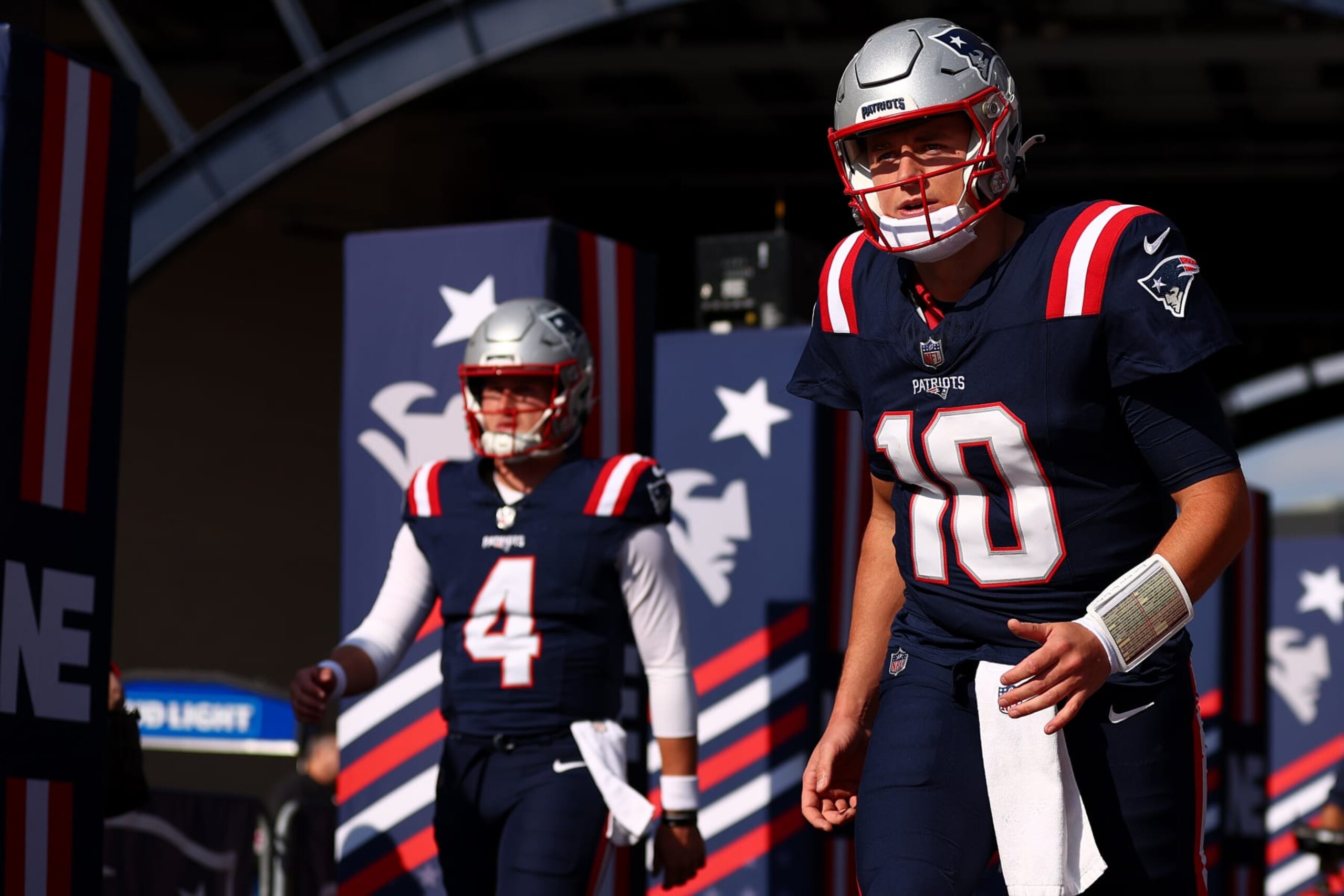 FOXBOROUGH, MASSACHUSETTS - NOVEMBER 05: Mac Jones #10 of the New England Patriots and Bailey Zappe #4 walk onto the field before the game against the Washington Commanders at Gillette Stadium on November 05, 2023 in Foxborough, Massachusetts. (Photo by Maddie Meyer/Getty Images)