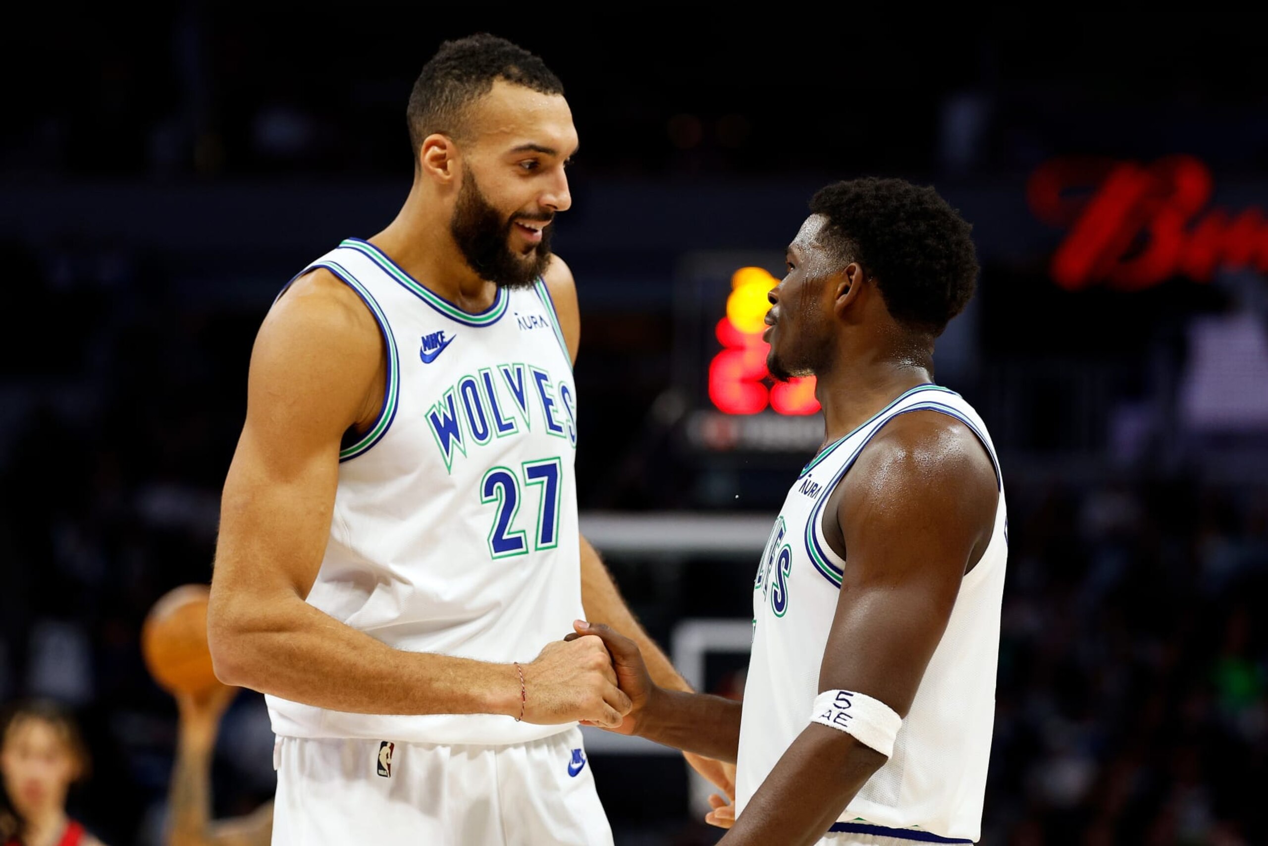 MINNEAPOLIS, MINNESOTA - NOVEMBER 08: Rudy Gobert #27 interacts with Anthony Edwards #5 of the Minnesota Timberwolves in the third quarter against the New Orleans Pelicans at Target Center on November 08, 2023 in Minneapolis, Minnesota. The Timberwolves defeated the Pelicans 122-101. NOTE TO USER: User expressly acknowledges and agrees that, by downloading and or using this photograph, User is consenting to the terms and conditions of the Getty Images License Agreement. (Photo by David Berding/Getty Images)
