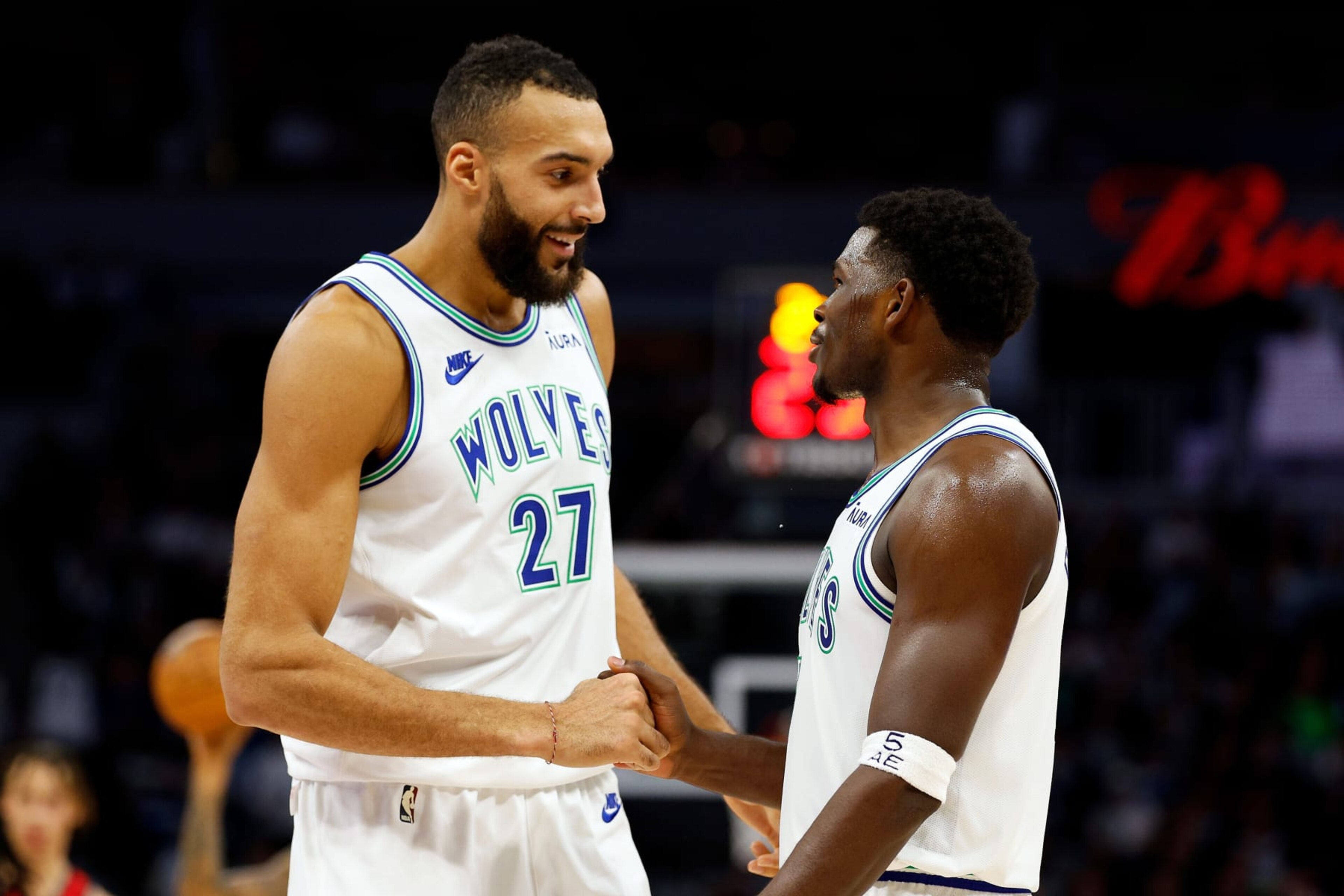 MINNEAPOLIS, MINNESOTA - NOVEMBER 08: Rudy Gobert #27 interacts with Anthony Edwards #5 of the Minnesota Timberwolves in the third quarter against the New Orleans Pelicans at Target Center on November 08, 2023 in Minneapolis, Minnesota. The Timberwolves defeated the Pelicans 122-101. NOTE TO USER: User expressly acknowledges and agrees that, by downloading and or using this photograph, User is consenting to the terms and conditions of the Getty Images License Agreement. (Photo by David Berding/Getty Images)