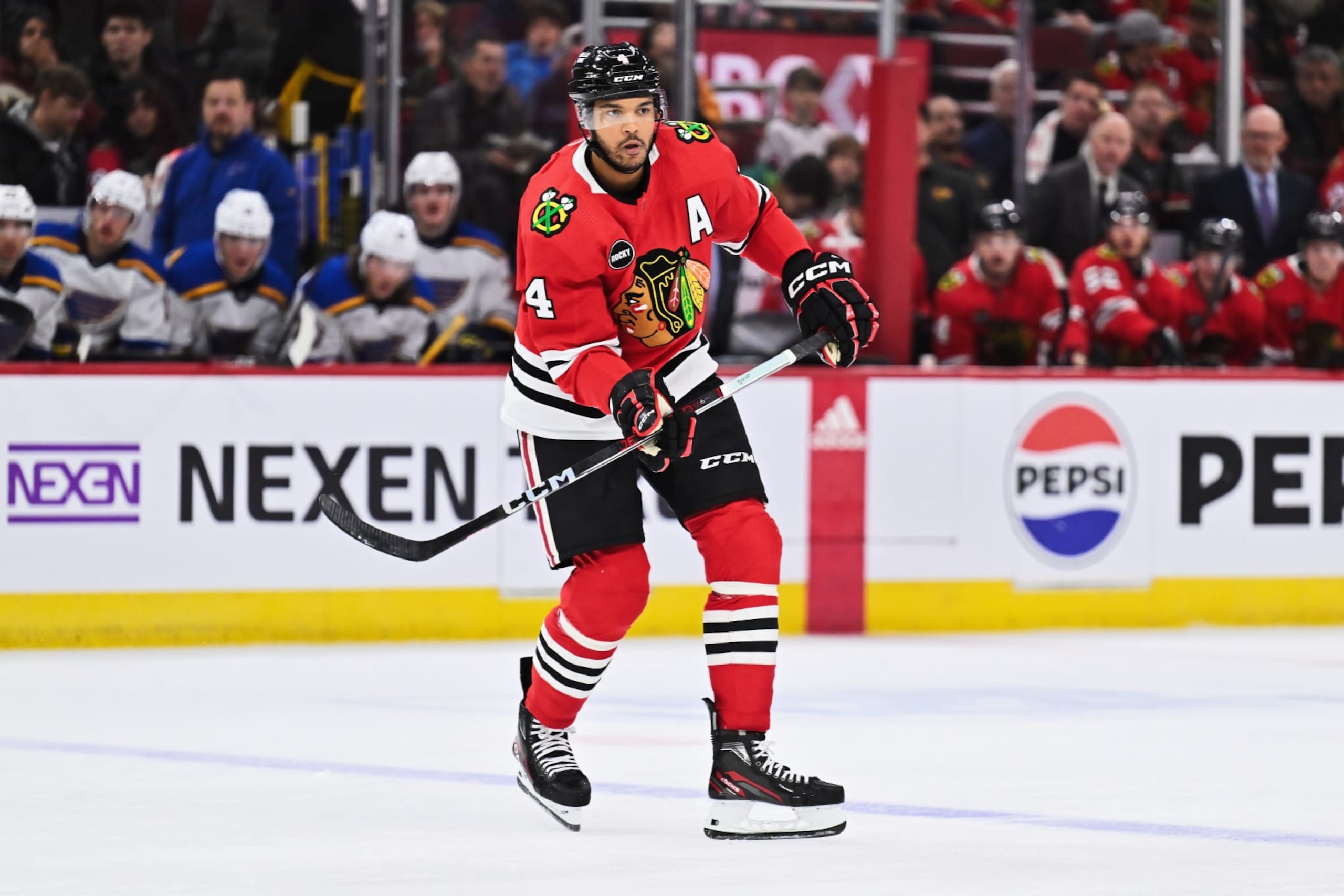 CHICAGO, ILLINOIS - NOVEMBER 26:  Seth Jones #4 of the Chicago Blackhawks skates against the St. Louis Blues on November 26, 2023 at United Center in Chicago, Illinois.  (Photo by Jamie Sabau/Getty Images)