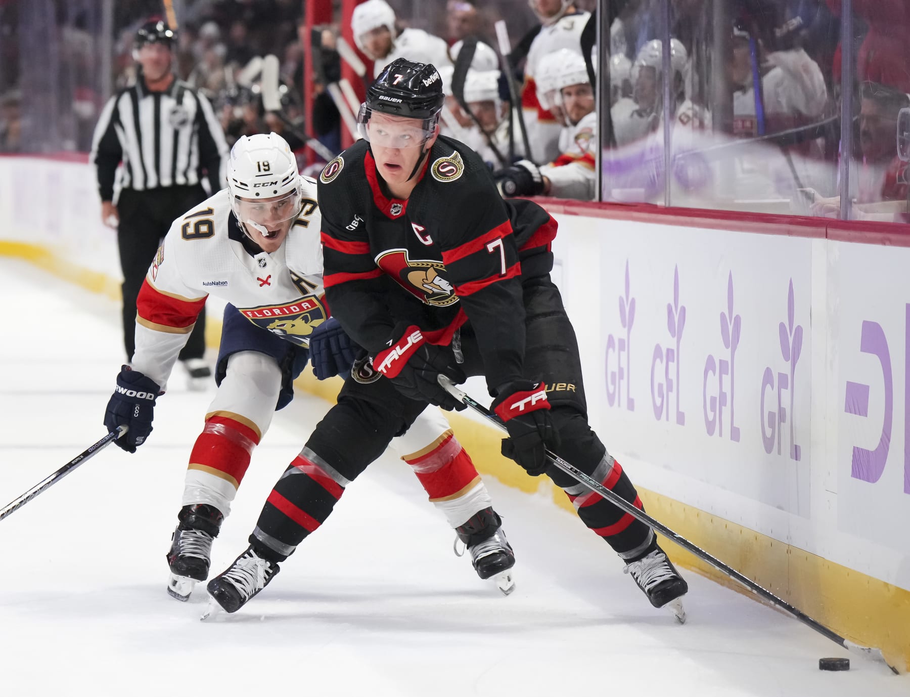 OTTAWA, CANADA - NOVEMBER 27: Brady Tkachuk #7 of the Ottawa Senators battles for puck possession against Matthew Tkachuk #19 of the Florida Panthers at Canadian Tire Centre on November 27, 2023 in Ottawa, Ontario, Canada.  (Photo by André Ringuette/NHLI via Getty Images)