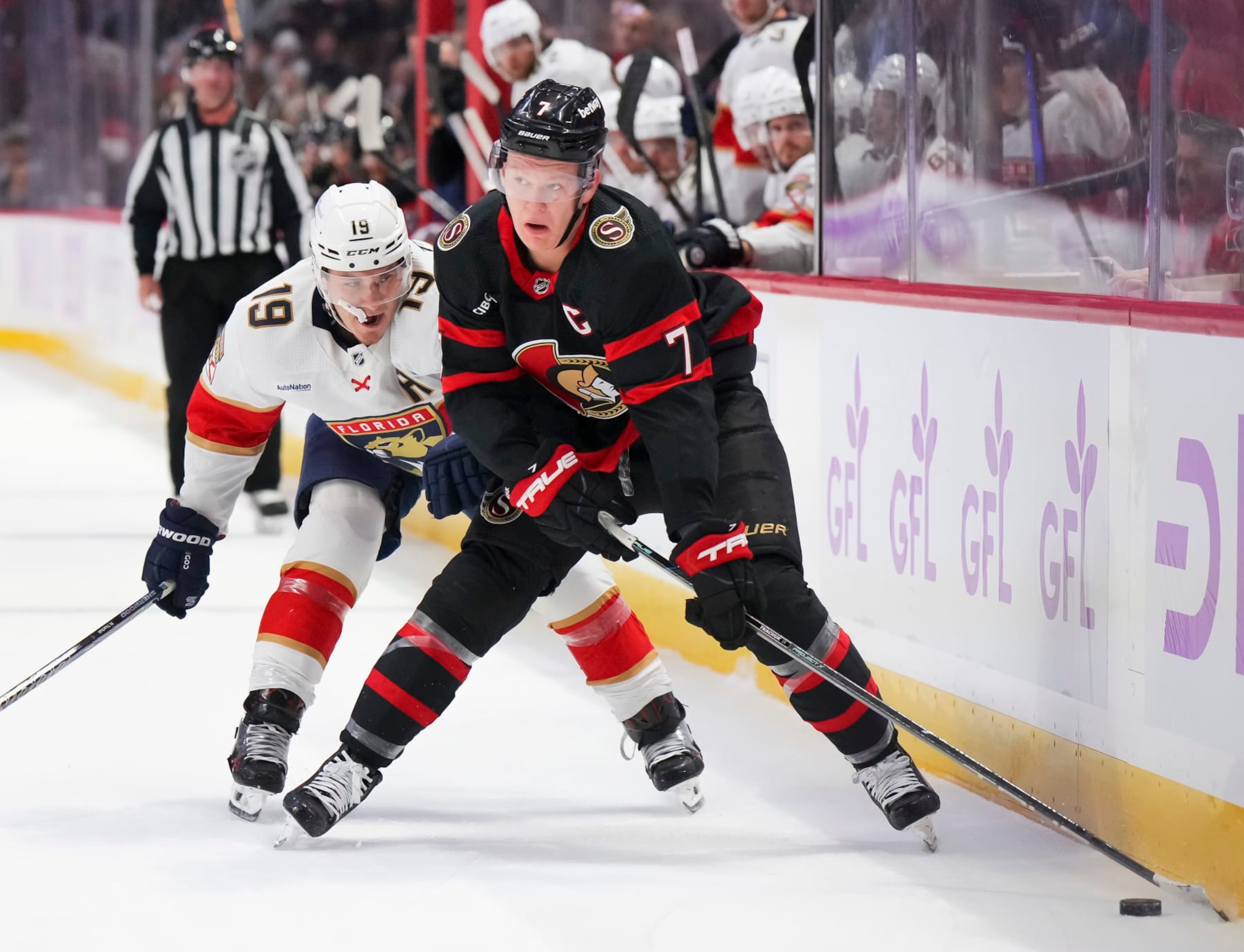 OTTAWA, CANADA - NOVEMBER 27: Brady Tkachuk #7 of the Ottawa Senators battles for puck possession against Matthew Tkachuk #19 of the Florida Panthers at Canadian Tire Centre on November 27, 2023 in Ottawa, Ontario, Canada.  (Photo by André Ringuette/NHLI via Getty Images)