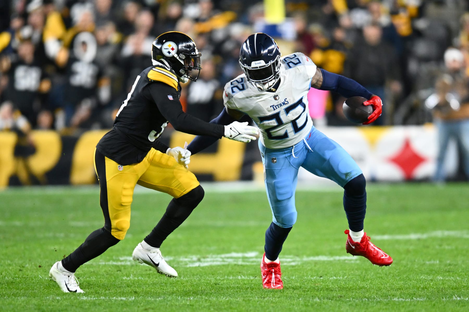 PITTSBURGH, PENNSYLVANIA - NOVEMBER 02: Derrick Henry #22 of the Tennessee Titans runs for a first down in the first quarter against the Pittsburgh Steelers at Acrisure Stadium on November 02, 2023 in Pittsburgh, Pennsylvania. (Photo by Joe Sargent/Getty Images)