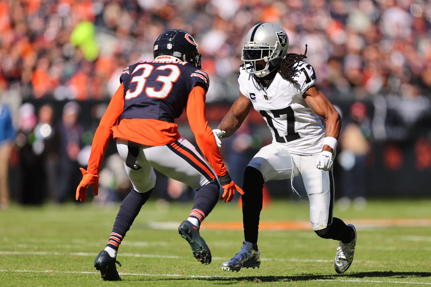 CHICAGO, ILLINOIS - OCTOBER 22: Davante Adams #17 of the Las Vegas Raiders in action against Jaylon Johnson #33 of the Chicago Bears at Soldier Field on October 22, 2023 in Chicago, Illinois. (Photo by Michael Reaves/Getty Images)