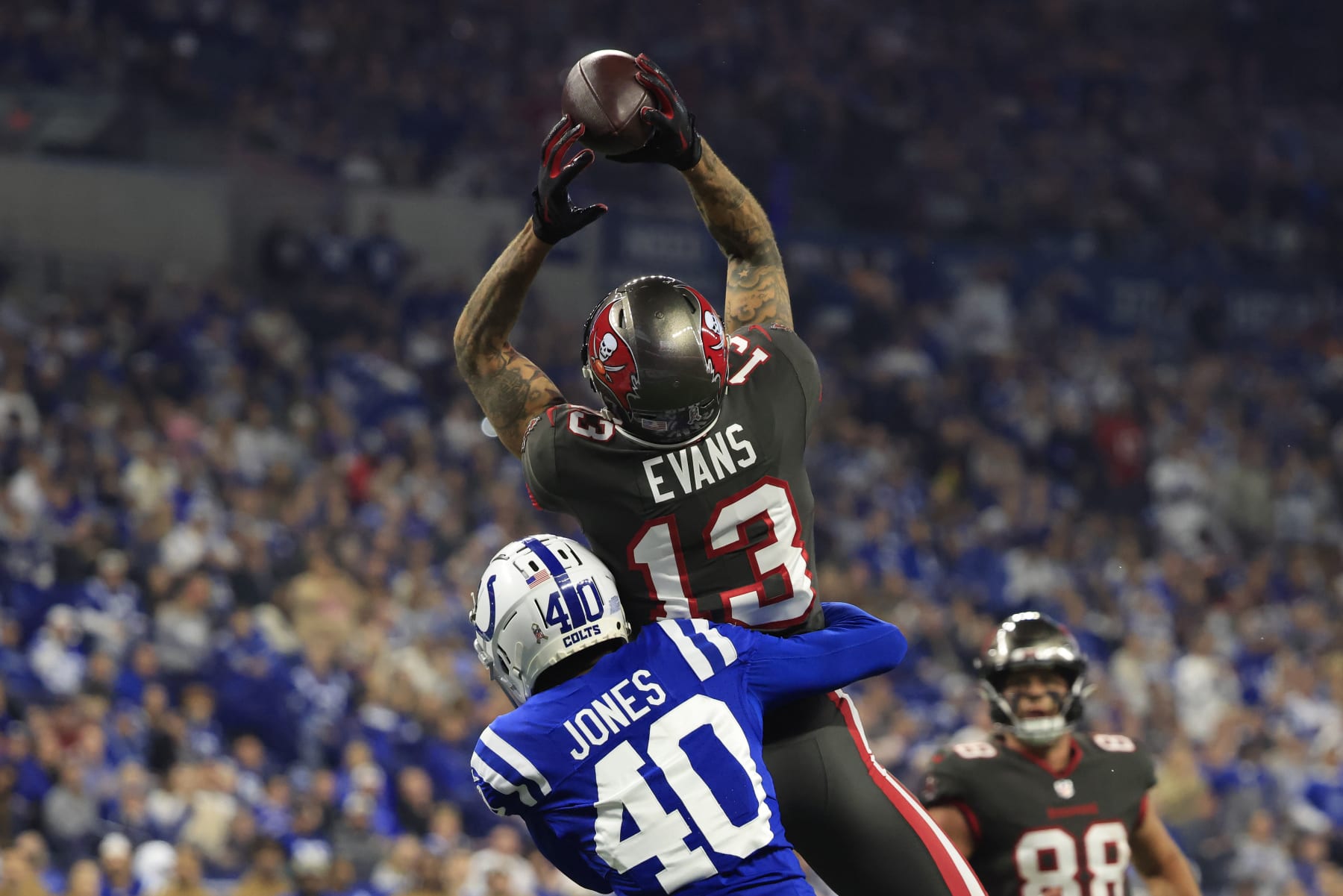 INDIANAPOLIS, INDIANA - NOVEMBER 26: Mike Evans #13 of the Tampa Bay Buccaneers catches a pass while defended by Jaylon Jones #40 of the Indianapolis Colts at Lucas Oil Stadium on November 26, 2023 in Indianapolis, Indiana. (Photo by Justin Casterline/Getty Images)