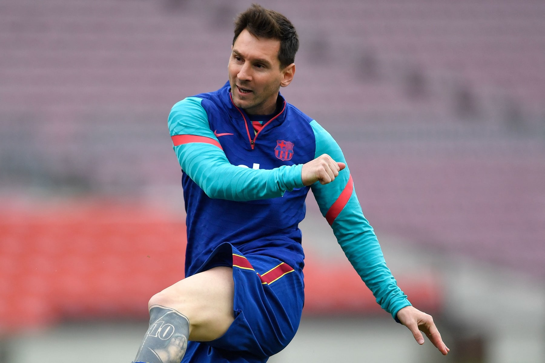 Barcelona's Argentine forward Lionel Messi warms up before the Spanish League football match between FC Barcelona  ans RC Celta de Vigo at the Camp Nou stadium in Barcelona on May 16, 2021. (Photo by Pau BARRENA / AFP) (Photo by PAU BARRENA/AFP via Getty Images)