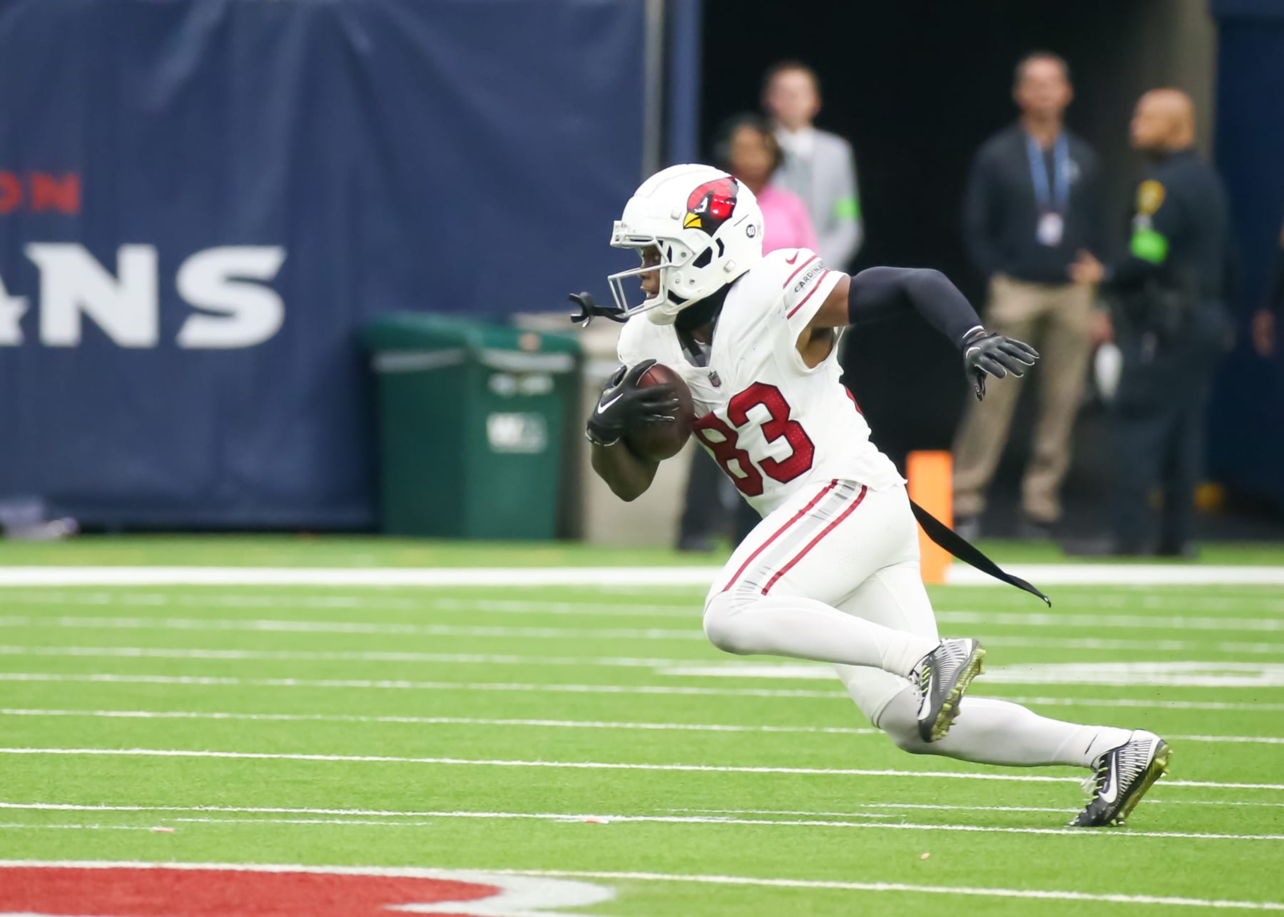 HOUSTON, TX - NOVEMBER 19:  Arizona Cardinals wide receiver Greg Dortch (83) carries the ball in the fourth quarter during the NFL game between the Arizona Cardinals and Houston Texans on November 19, 2023 at NRG Stadium in Houston, Texas.  (Photo by Leslie Plaza Johnson/Icon Sportswire via Getty Images)