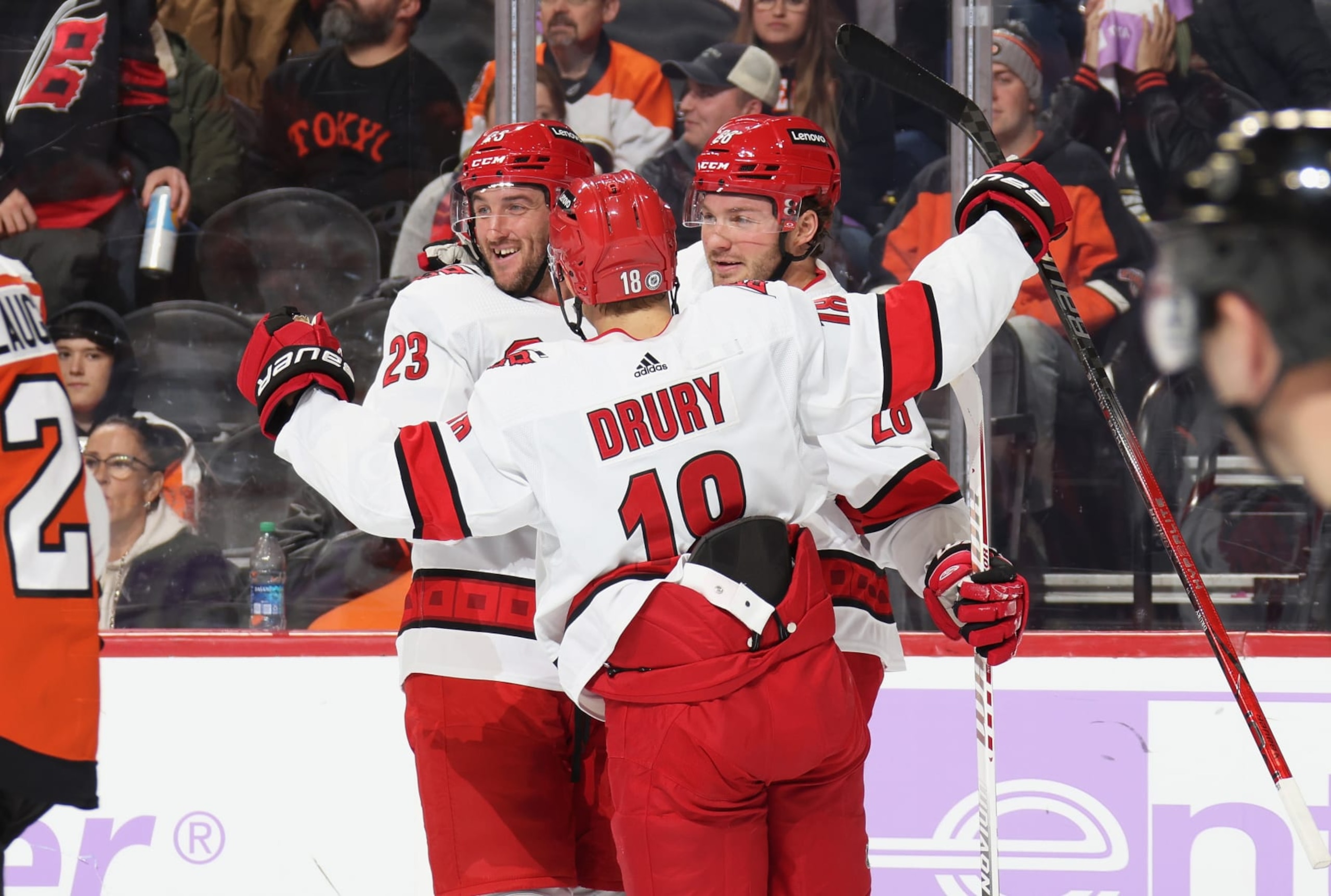 PHILADELPHIA, PENNSYLVANIA - NOVEMBER 28: Brendan Lemieux #28 of the Carolina Hurricanes celebrates his second period goal against the Philadelphia Flyers with Stefan Noesen #23 and Jack Drury #18 at the Wells Fargo Center on November 28, 2023 in Philadelphia, Pennsylvania.  (Photo by Len Redkoles/NHLI via Getty Images)