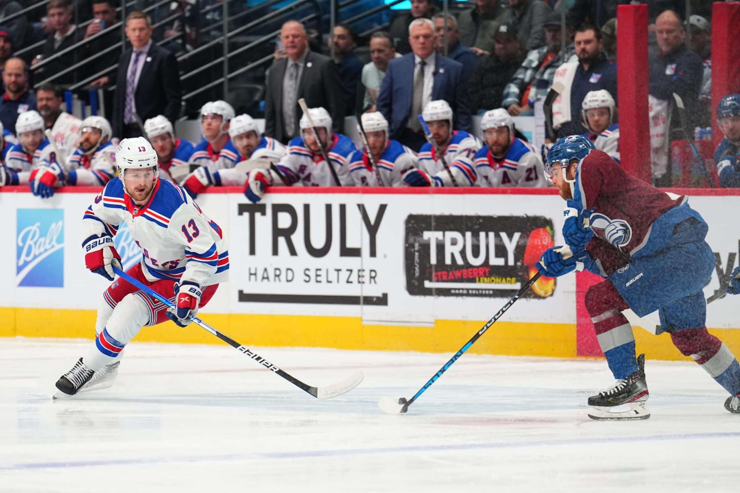 DENVER, COLORADO - DECEMBER 09: Alexis Lafrenière #13 of the New York Rangers defends against J.T. Compher #37 of the Colorado Avalanche at Ball Arena on December 09, 2022 in Denver, Colorado. (Photo by Jack Dempsey/Getty Images)