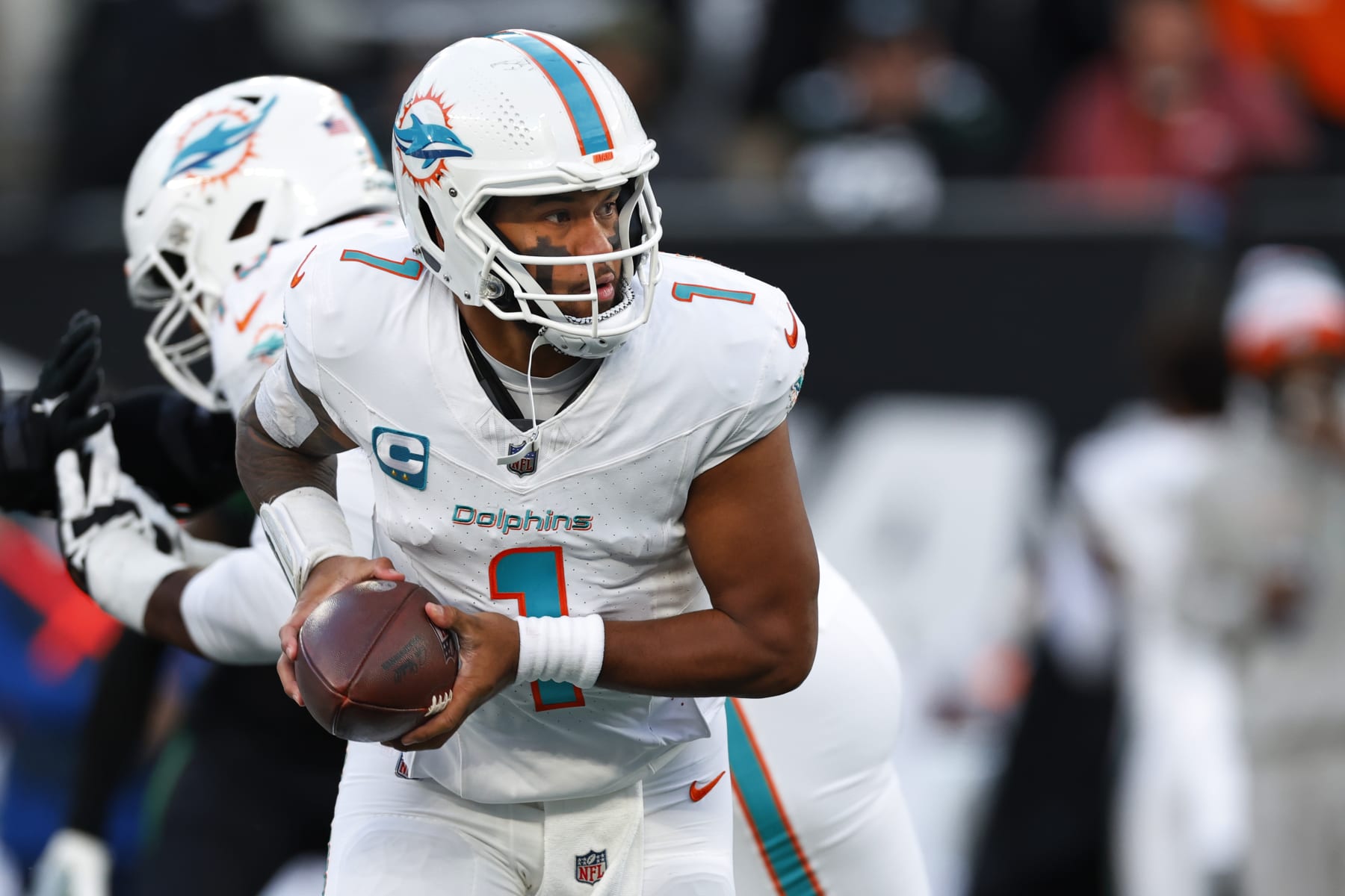 EAST RUTHERFORD, NEW JERSEY - NOVEMBER 24: Quarterback Tua Tagovailoa #1 of the Miami Dolphins in action against the New York Jets during a football game at MetLife Stadium on November 24, 2023 in East Rutherford, New Jersey. (Photo by Rich Schultz/Getty Images)