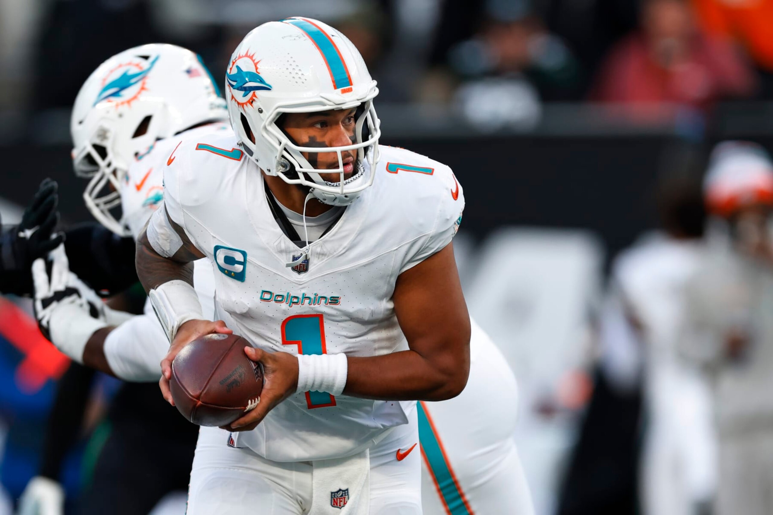 EAST RUTHERFORD, NEW JERSEY - NOVEMBER 24: Quarterback Tua Tagovailoa #1 of the Miami Dolphins in action against the New York Jets during a football game at MetLife Stadium on November 24, 2023 in East Rutherford, New Jersey. (Photo by Rich Schultz/Getty Images)
