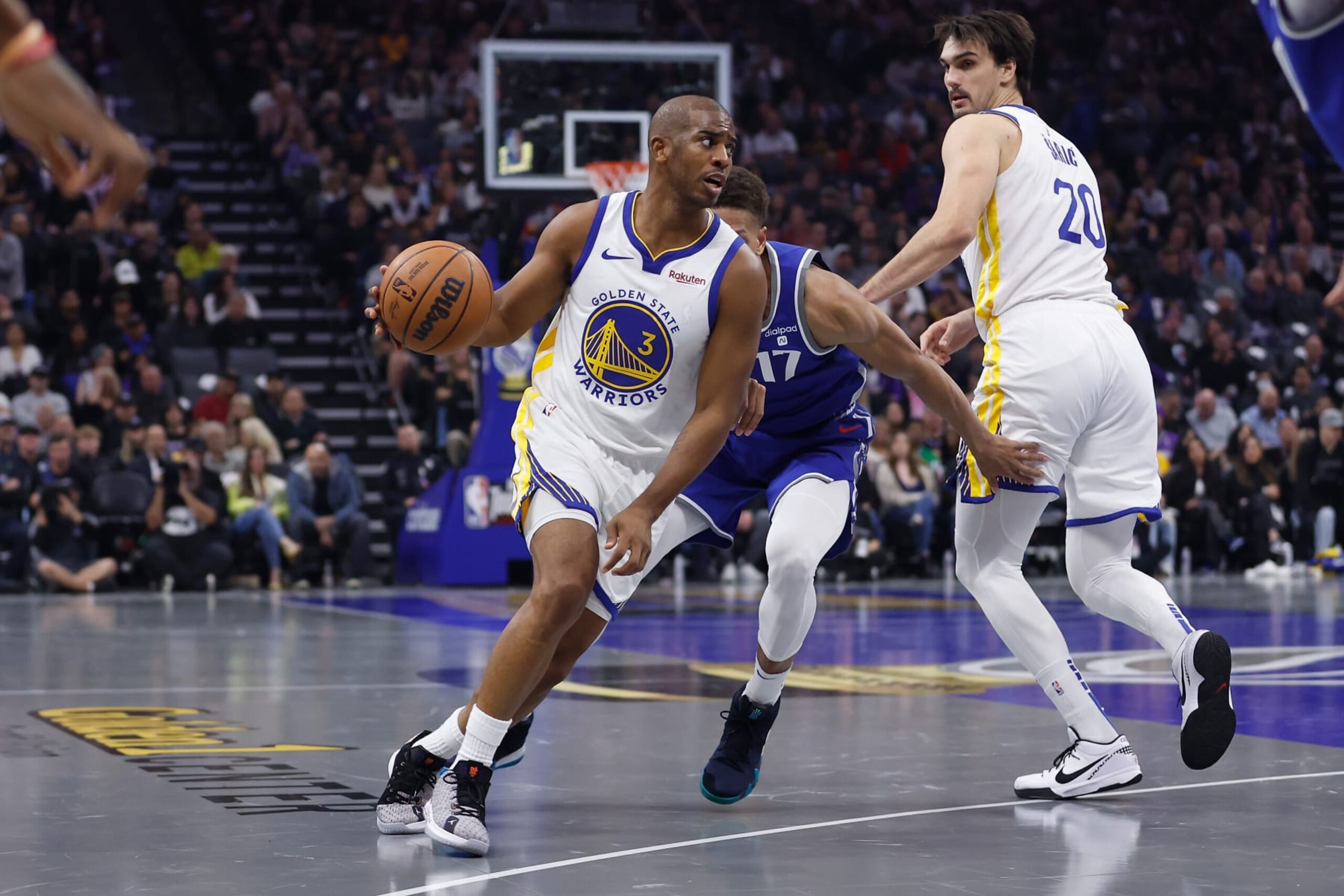 SACRAMENTO, CALIFORNIA - NOVEMBER 28: Chris Paul #3 of the Golden State Warriors drives against Kessler Edwards #17 of the Sacramento Kings in the first quarter during the NBA In-Season Tournament game at Golden 1 Center on November 28, 2023 in Sacramento, California. NOTE TO USER: User expressly acknowledges and agrees that, by downloading and or using this photograph, User is consenting to the terms and conditions of the Getty Images License Agreement. (Photo by Lachlan Cunningham/Getty Images)