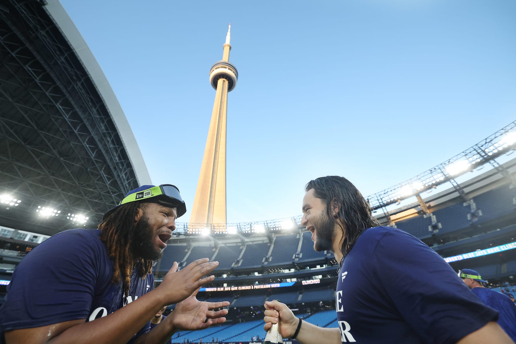 TORONTO, ON - OCTOBER 1  -  Toronto Blue Jays first baseman Vladimir Guerrero Jr. (27) and Toronto Blue Jays shortstop Bo Bichette (11)  celebrate clinching a wild card berth in the MLB play-offs as the Toronto Blue Jays play the Tampa Bay Rays in the season finale at Rogers Centre in Toronto. October 1, 2023.          (Steve Russell/Toronto Star via Getty Images)