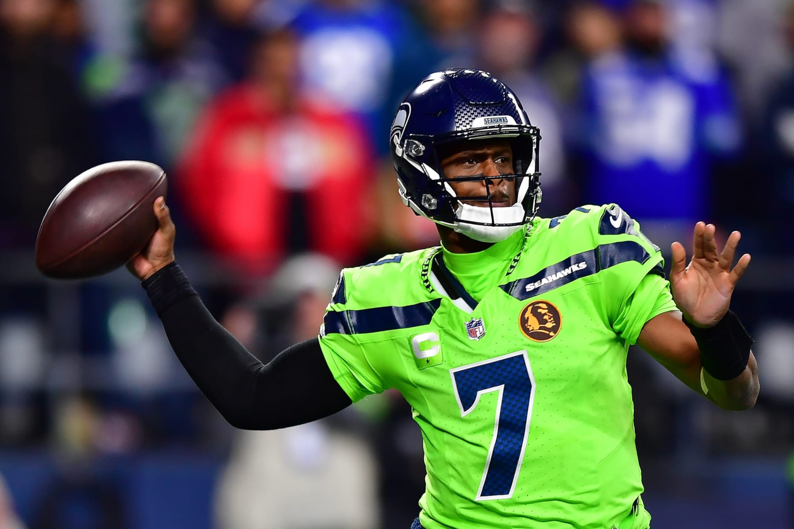 SEATTLE, WASHINGTON - NOVEMBER 23: Geno Smith #7 of the Seattle Seahawks looks to pass during the second quarter of a game against the San Francisco 49ers at Lumen Field on November 23, 2023 in Seattle, Washington. (Photo by Jane Gershovich/Getty Images)