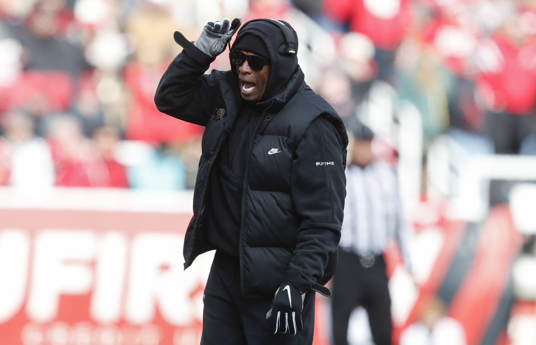 SALT LAKE CITY, UT - NOVEMBER 25:  Deion Sanders head coach of the Colorado Buffaloes calls a play during the first half of their game aginast the Utah Utes at Rice Eccles Stadium on November 25, 2023 in Salt Lake City, Utah.  (Photo by Chris Gardner/Getty Images)