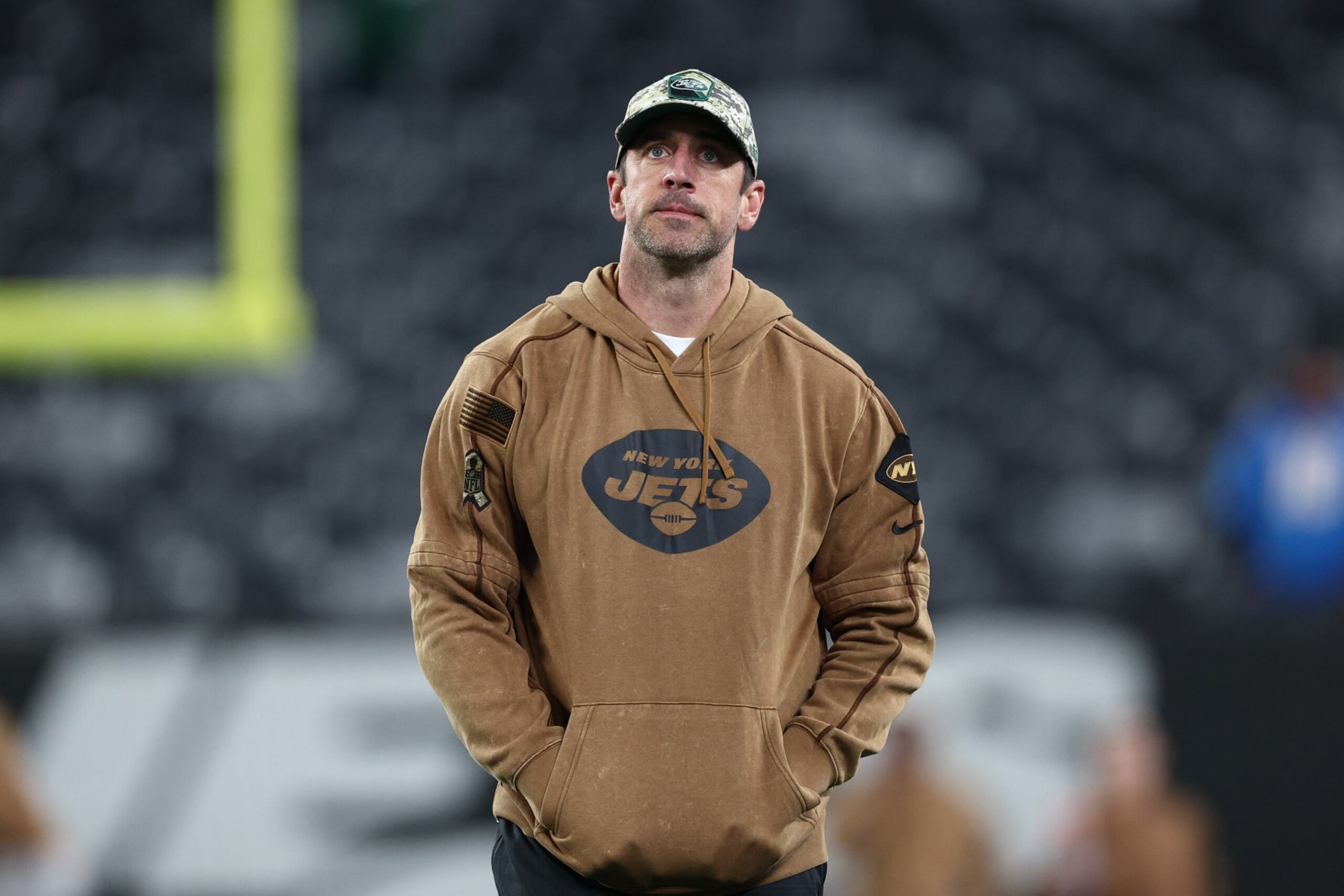 EAST RUTHERFORD, NEW JERSEY - NOVEMBER 06:  Aaron Rodgers #8 of the New York Jets looks on before the game against the Los Angeles Chargers at MetLife Stadium on November 06, 2023 in East Rutherford, New Jersey. (Photo by Elsa/Getty Images)