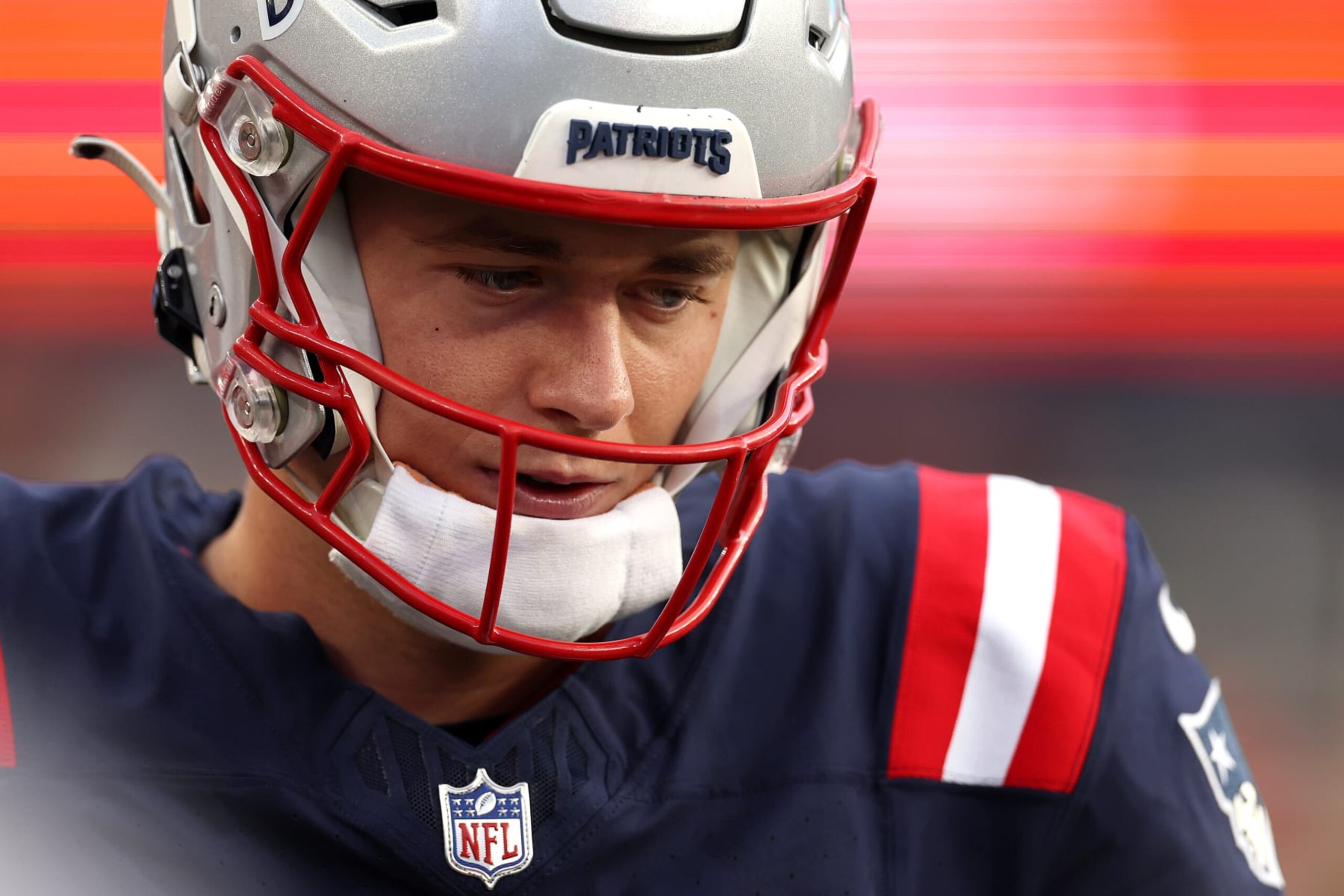 FOXBOROUGH, MASSACHUSETTS - NOVEMBER 05: Mac Jones #10 of the New England Patriots looks on from the sideline during the game against the Washington Commanders  at Gillette Stadium on November 05, 2023 in Foxborough, Massachusetts. (Photo by Maddie Meyer/Getty Images)