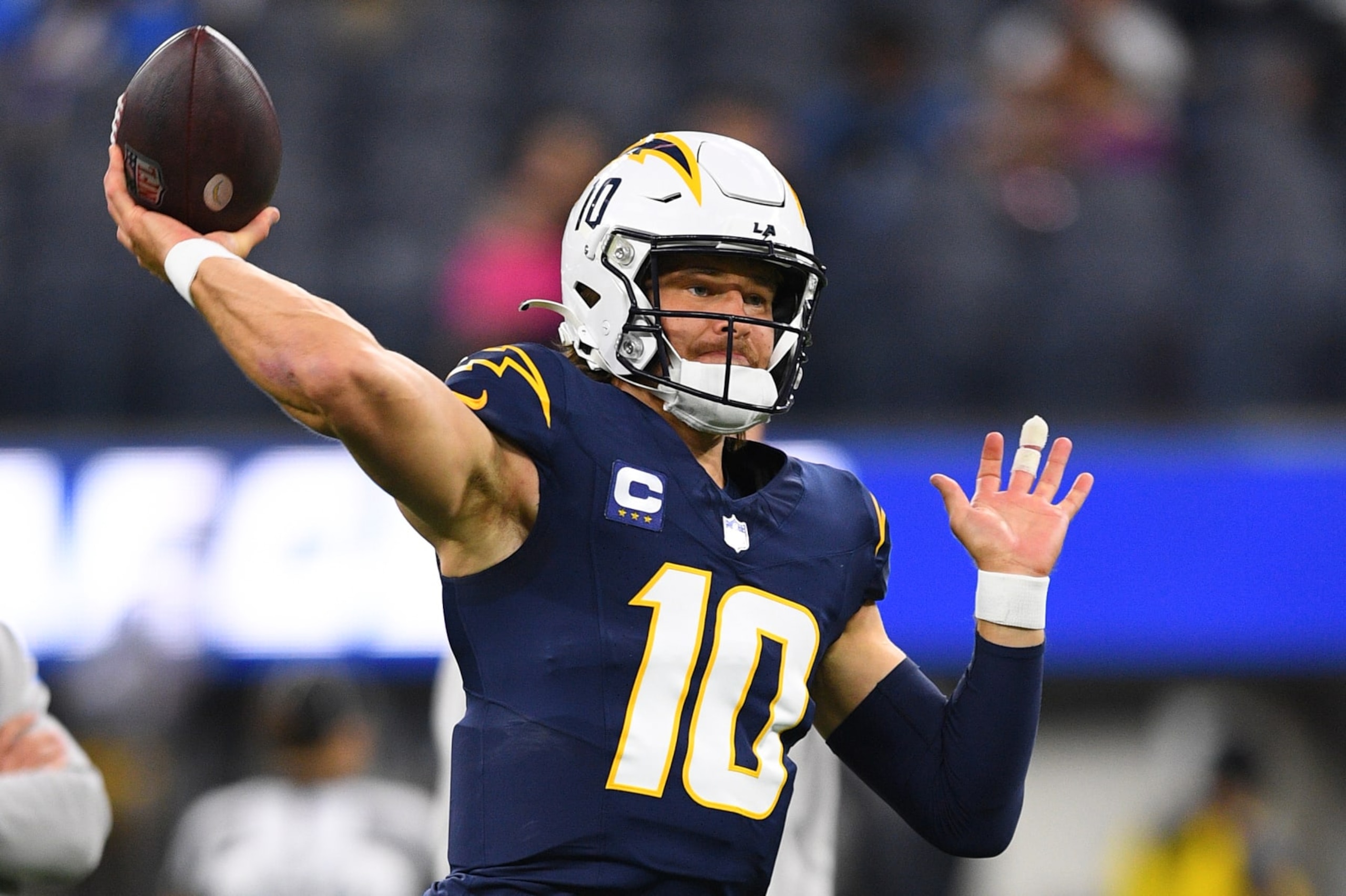 INGLEWOOD, CA - NOVEMBER 26: Los Angeles Chargers quarterback Justin Herbert (10) throws a pass during warmups before the NFL regular season game between the Baltimore Ravens and the Los Angeles Chargers on November 26, 2023, at SoFi Stadium in Inglewood, CA. (Photo by Brian Rothmuller/Icon Sportswire via Getty Images) INGLEWOOD, CA - NOVEMBER 26: Los Angeles Chargers quarterback Justin Herbert (10) throws a pass during warmups before the NFL regular season game between the Baltimore Ravens and the Los Angeles Chargers on November 26, 2023, at SoFi Stadium in Inglewood, CA. (Photo by Brian Rothmuller/Icon Sportswire via Getty Images)